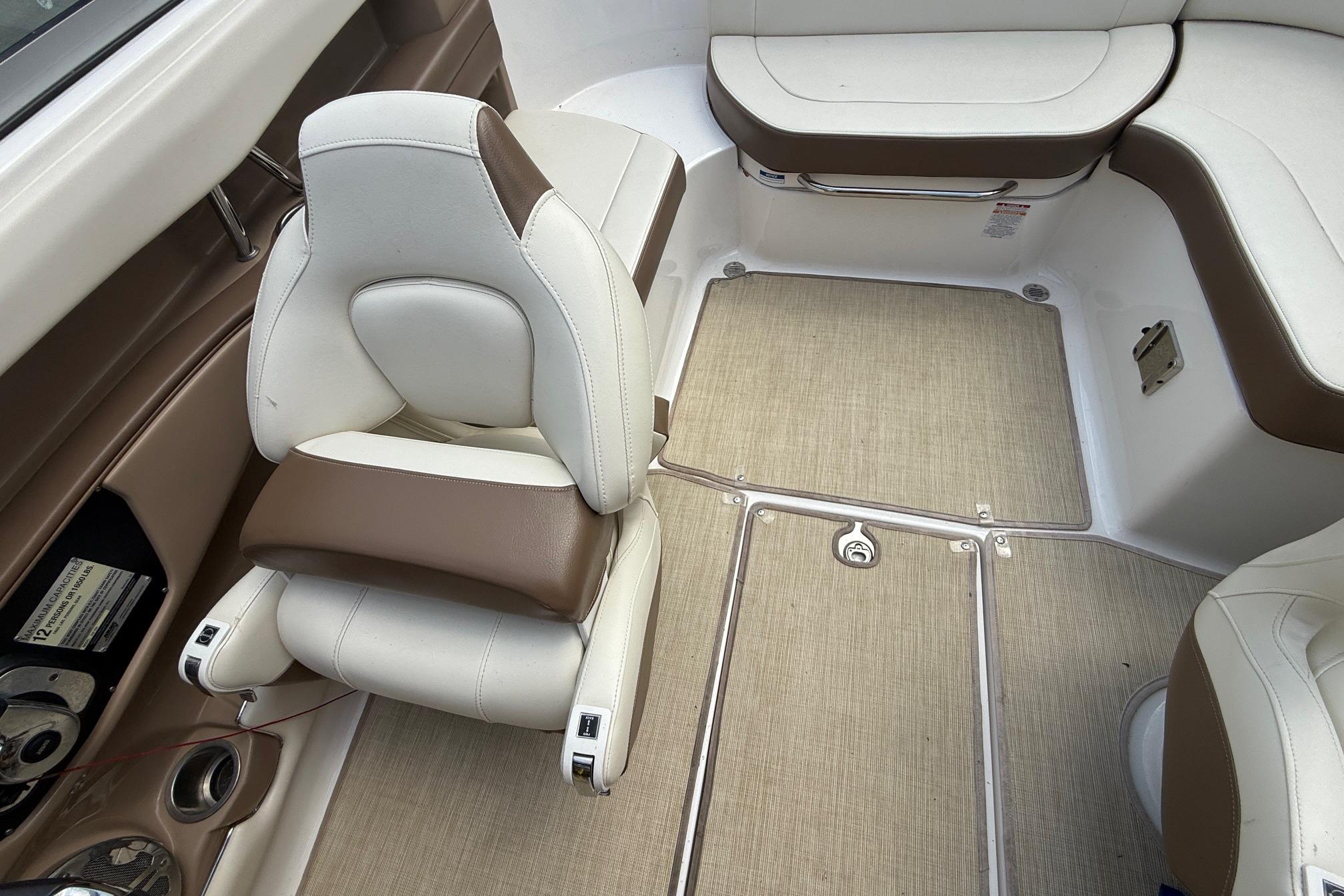 2016 Chaparral 226 SSi Wide Tech boat interior with beige and brown seating.