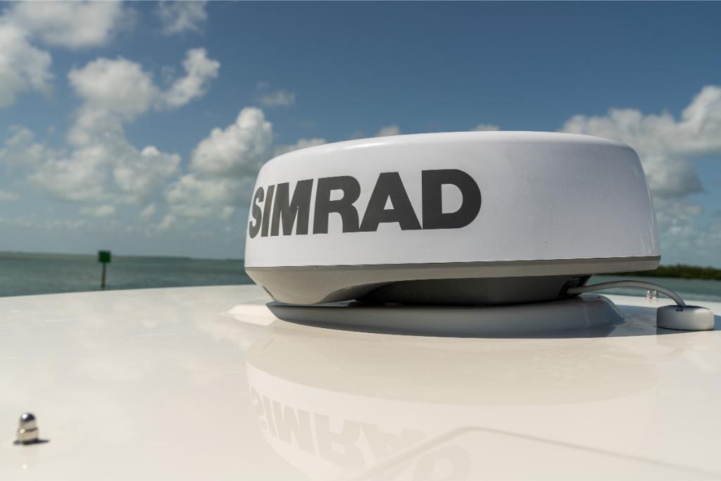 Simrad radar on 2024 Boston Whaler 280 Dauntless boat under clear sky.