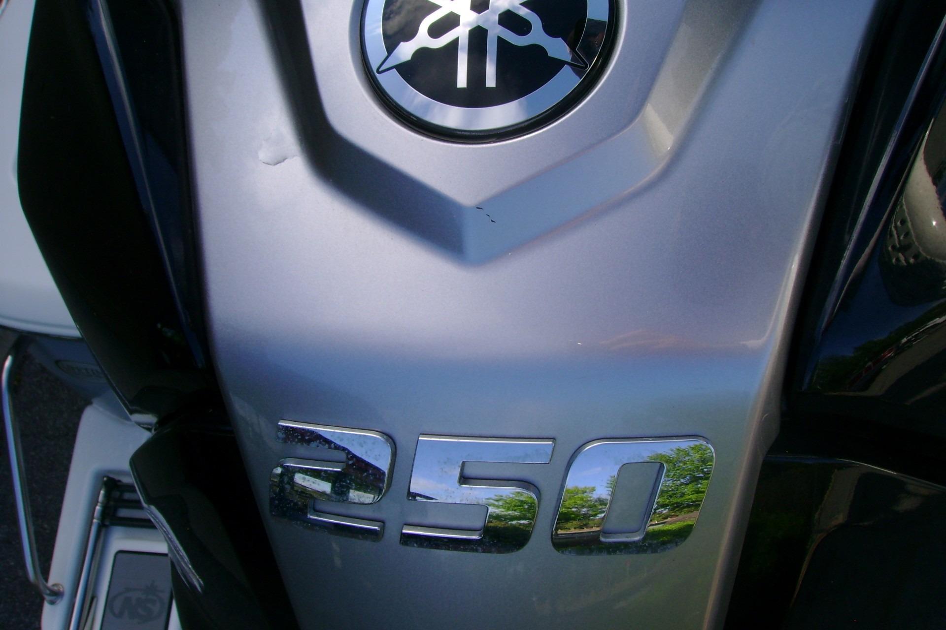 Close-up of a 2022 NauticStar 227 XTS boat engine with "250" emblem.