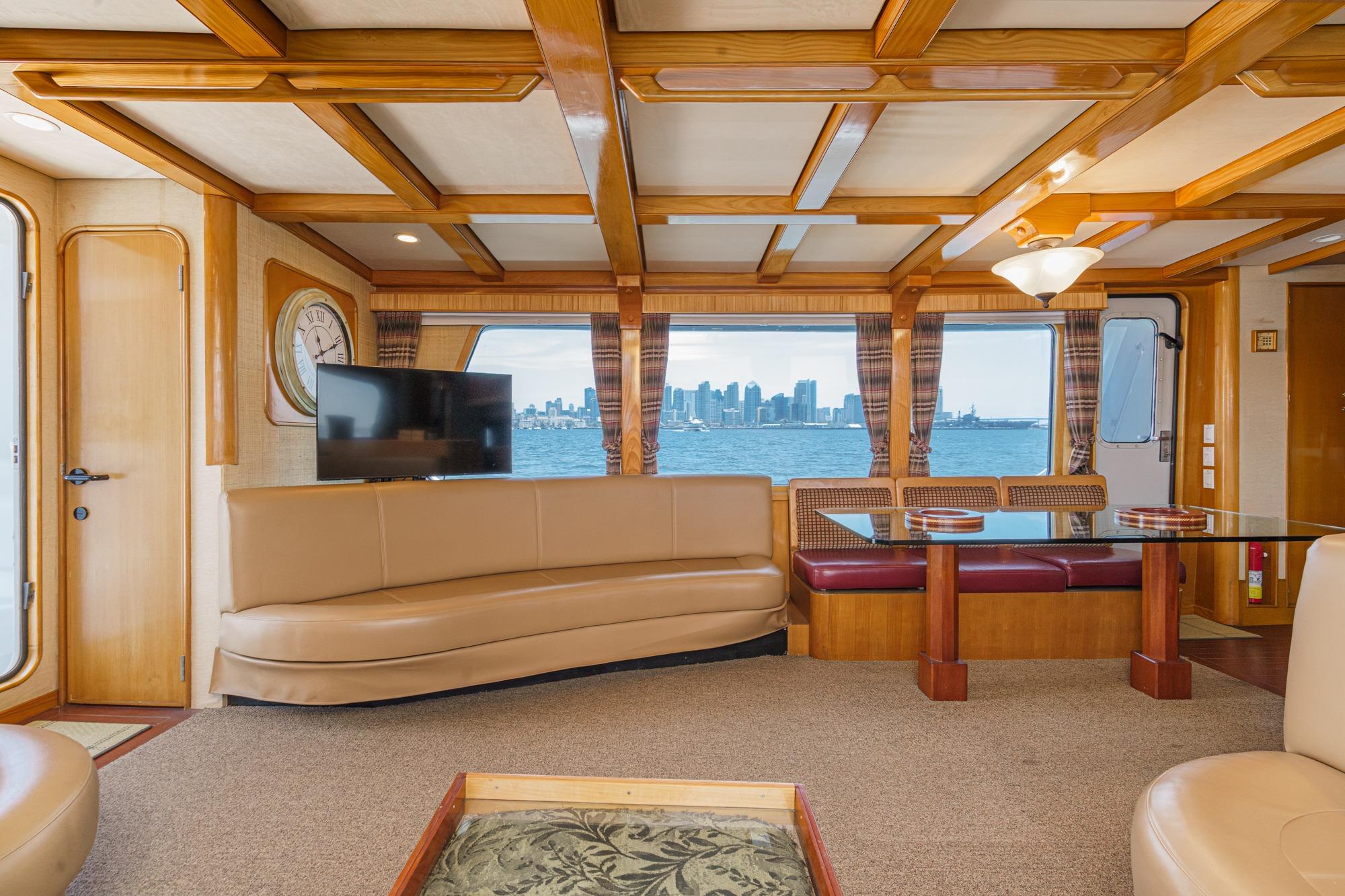 Luxurious interior of a 1990 Seaton Long Range Cruiser with city skyline view.
