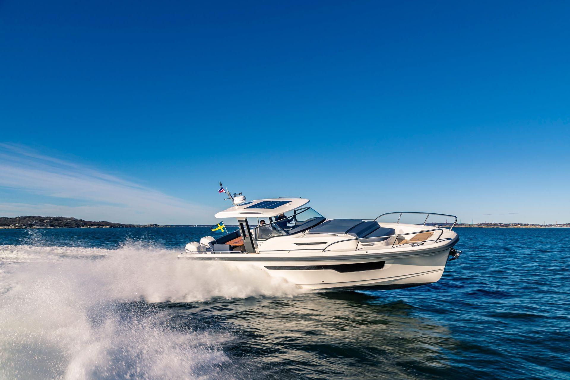 Nimbus T11 2025 motorboat cruising on open water under clear blue skies.