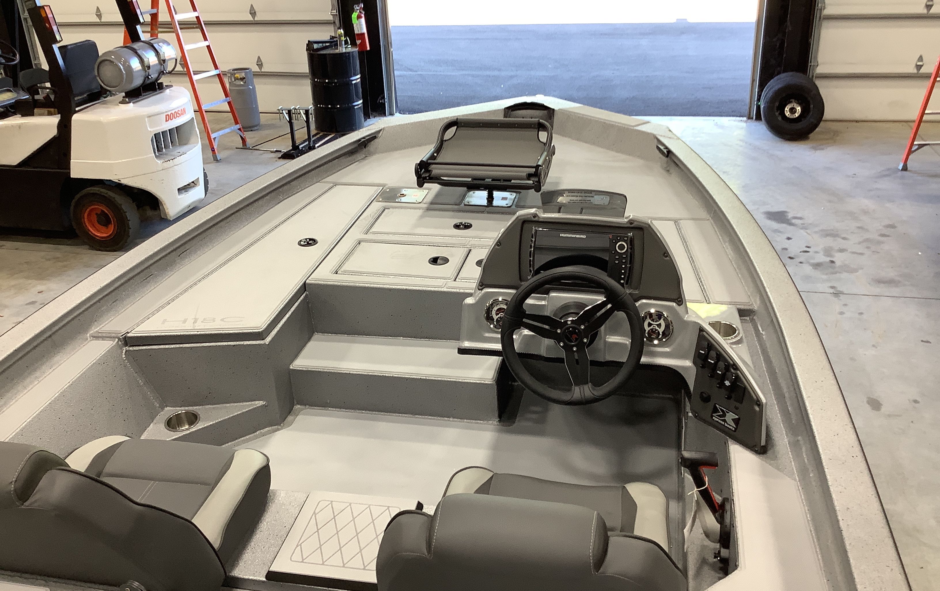 Interior view of 2026 Xpress Boats H18C with steering console.