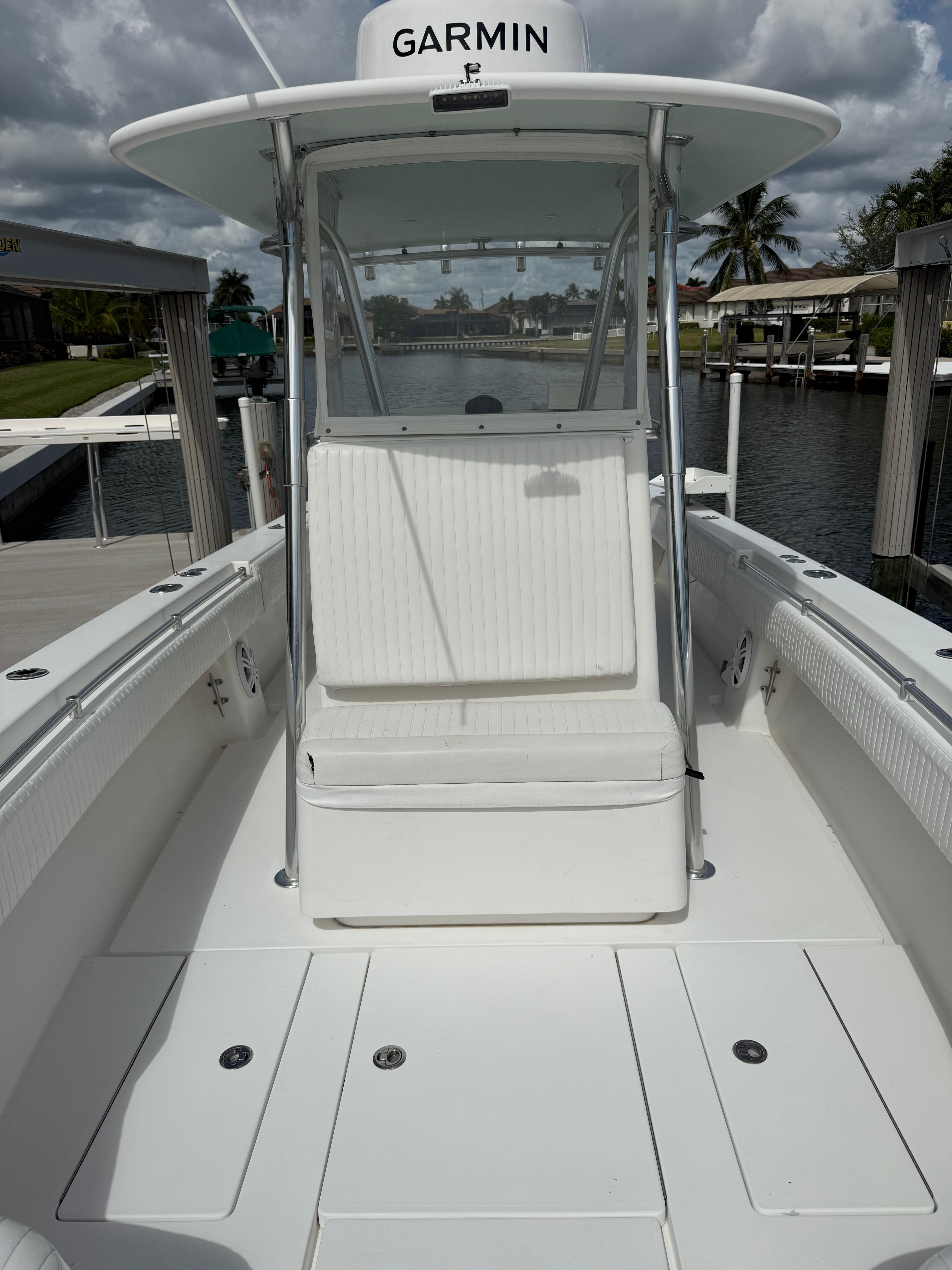 2012 Contender 32 ST boat with Garmin equipment, docked.