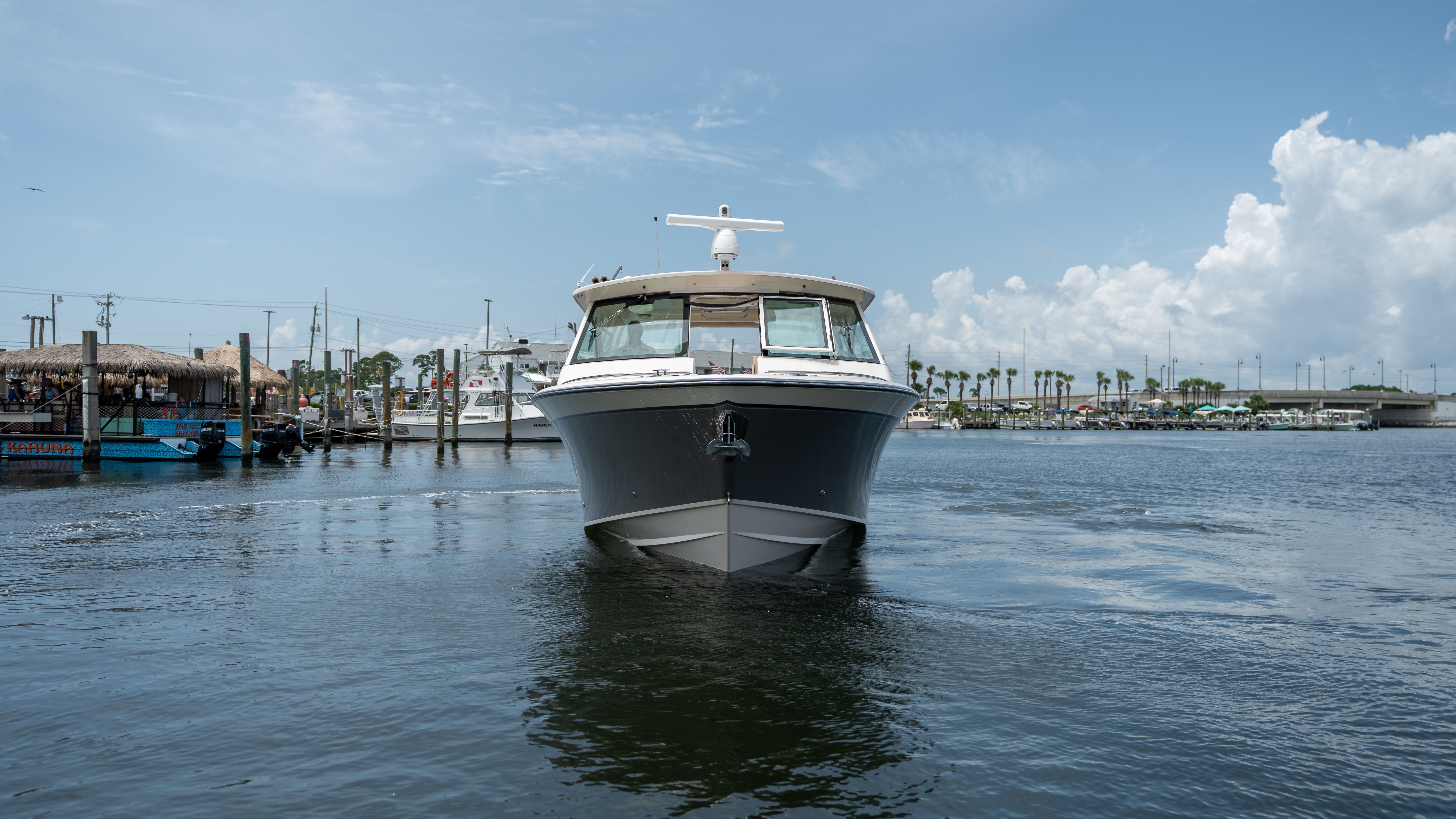2019 Grady-White 375 Freedom on calm water in a harbor.