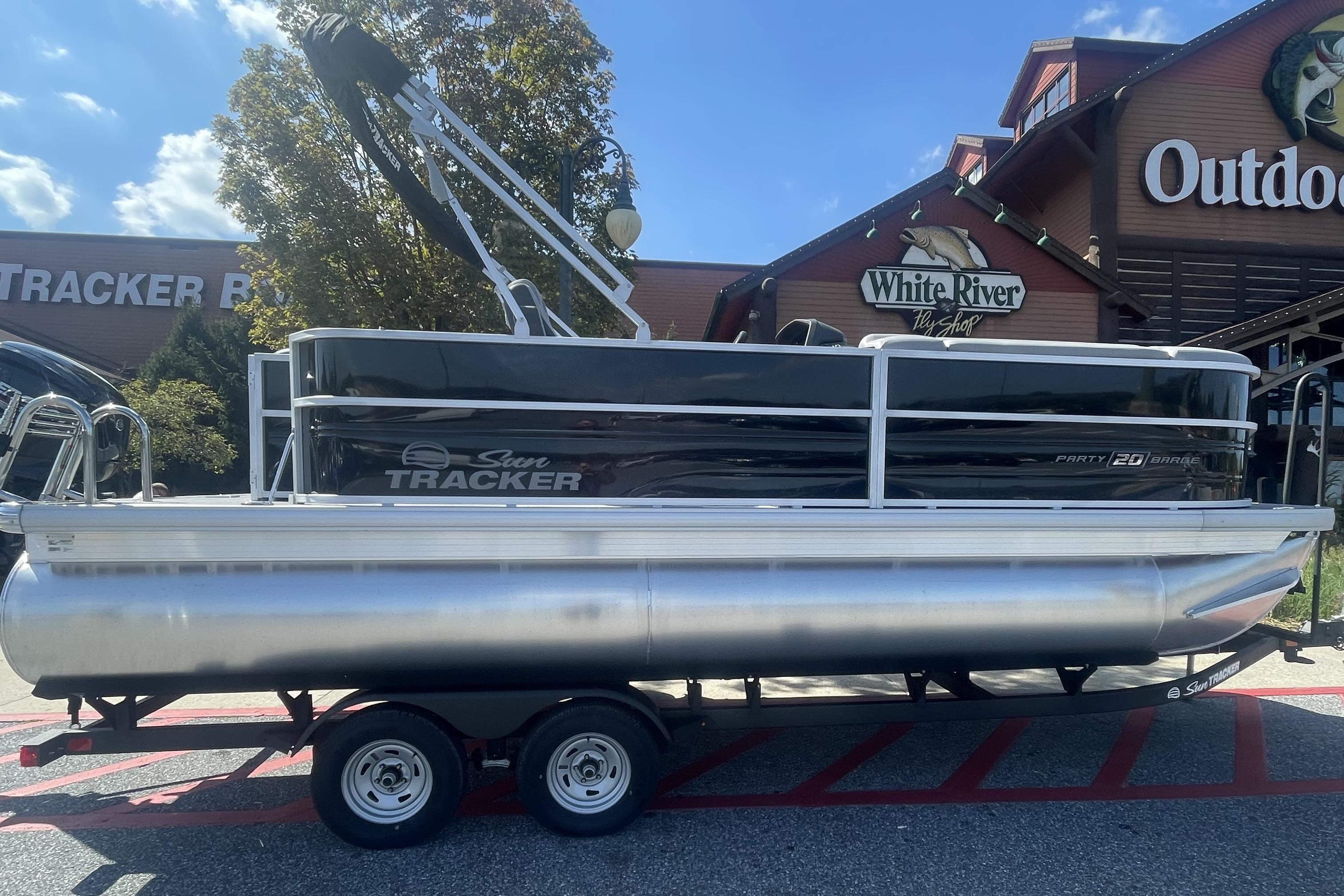 2026 Sun Tracker Party Barge 20 DLX pontoon boat displayed outdoors.