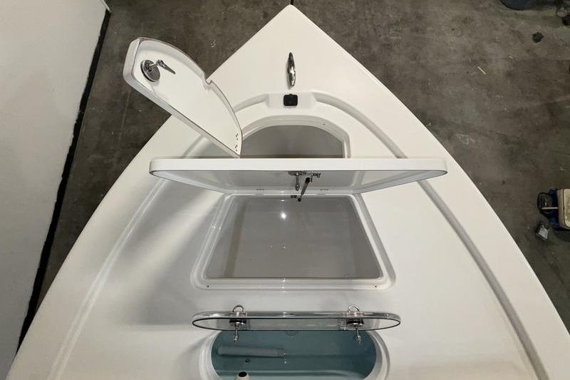 2026 Sea Pro 250 Bay boat storage compartments, open view from above.