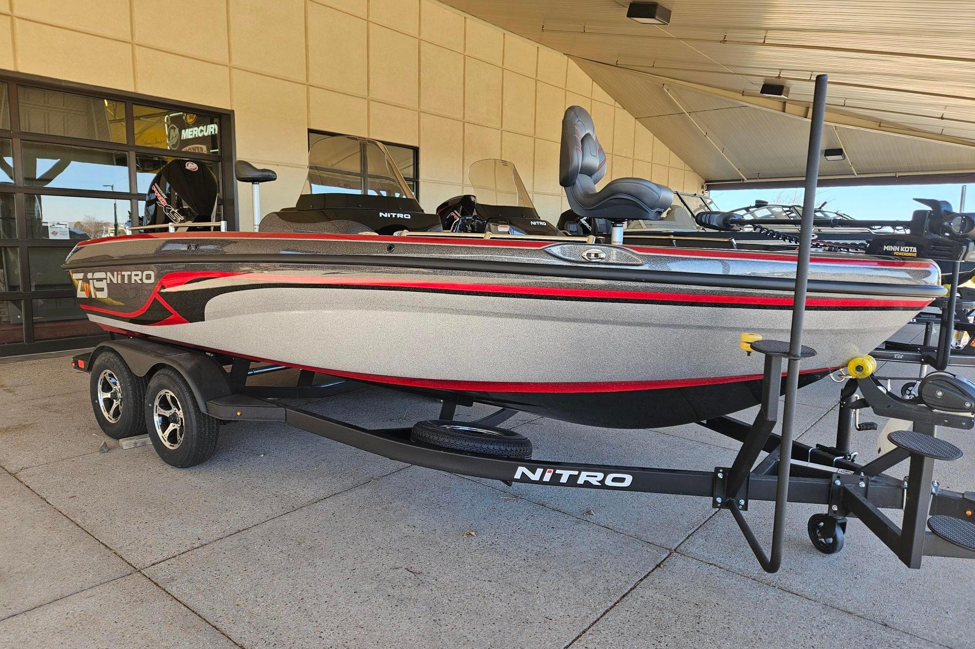 2025 Nitro ZV19 boat on trailer, sleek design with red and black accents.