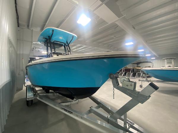 2024 Key West 219 FS boat in a showroom on a trailer.