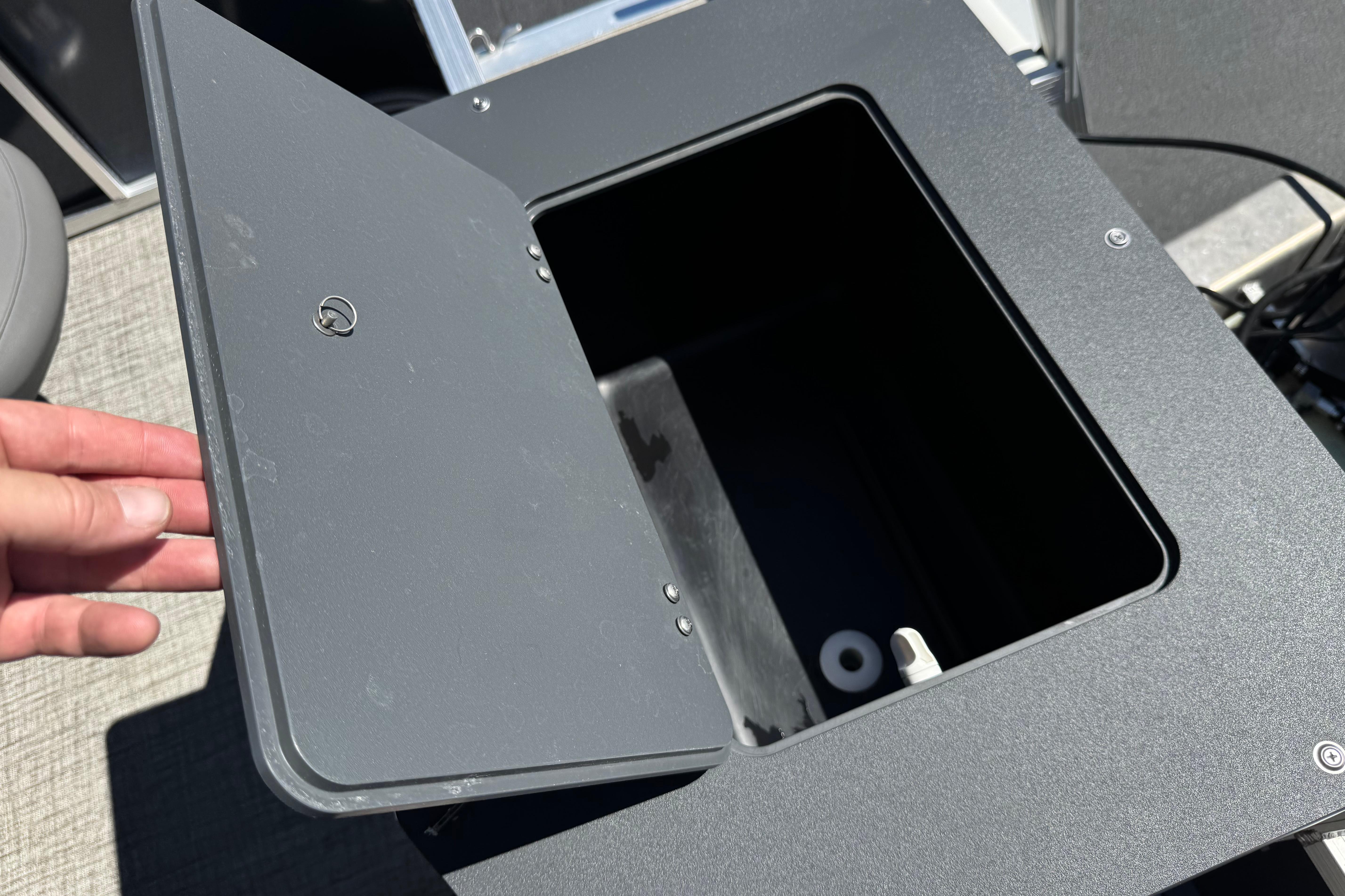 Open storage compartment on 2023 Avalon Venture Fish N Cruise boat.