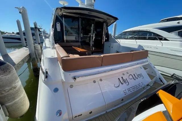 2016 Sea Ray Sundancer 510 yacht docked, featuring spacious seating and elegant design.
