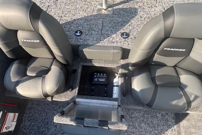2026 Tracker Pro Team 195 boat interior with gray seats and storage compartment.