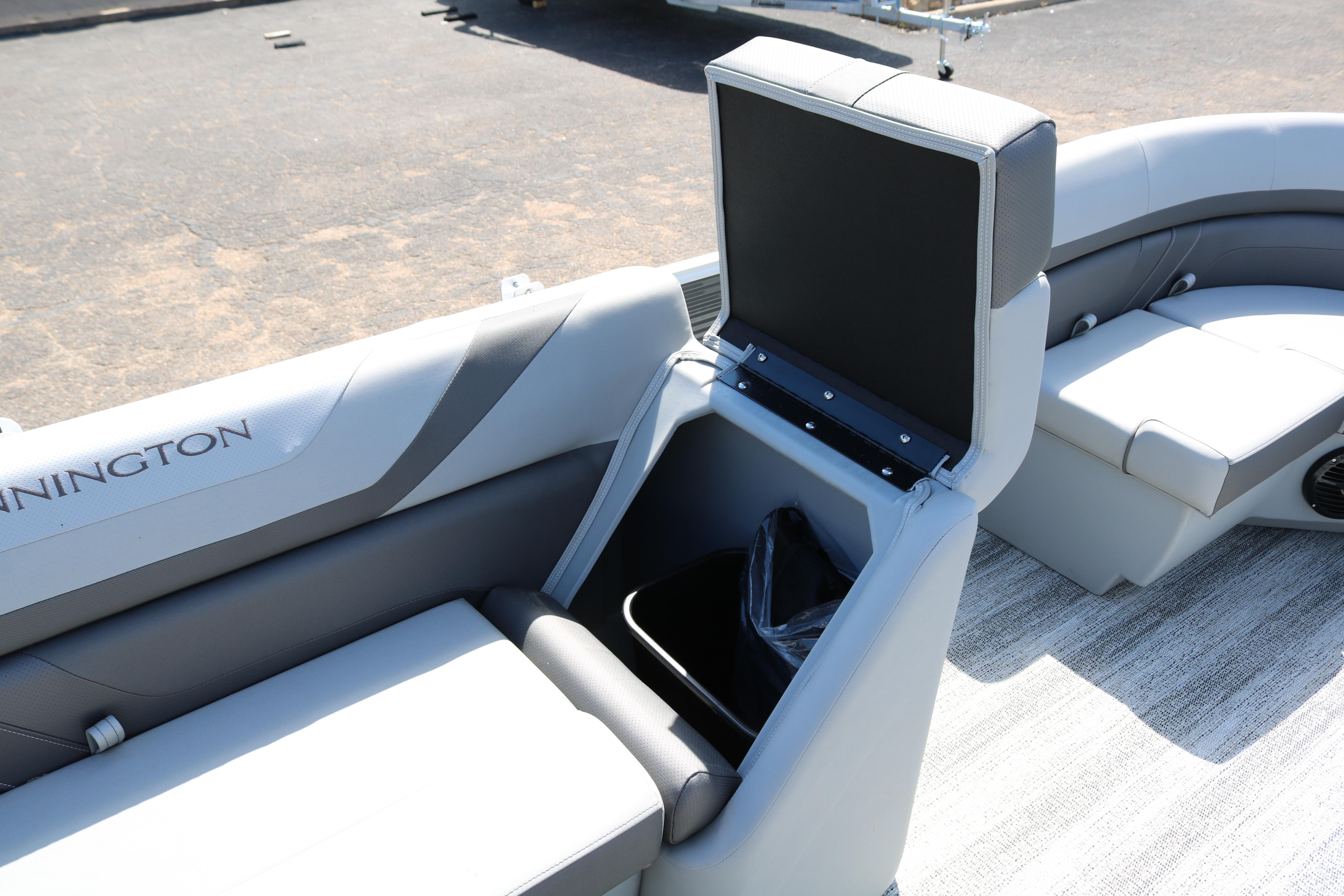 2026 Bennington 20SXSNP REAR FISH boat interior with storage compartment open.