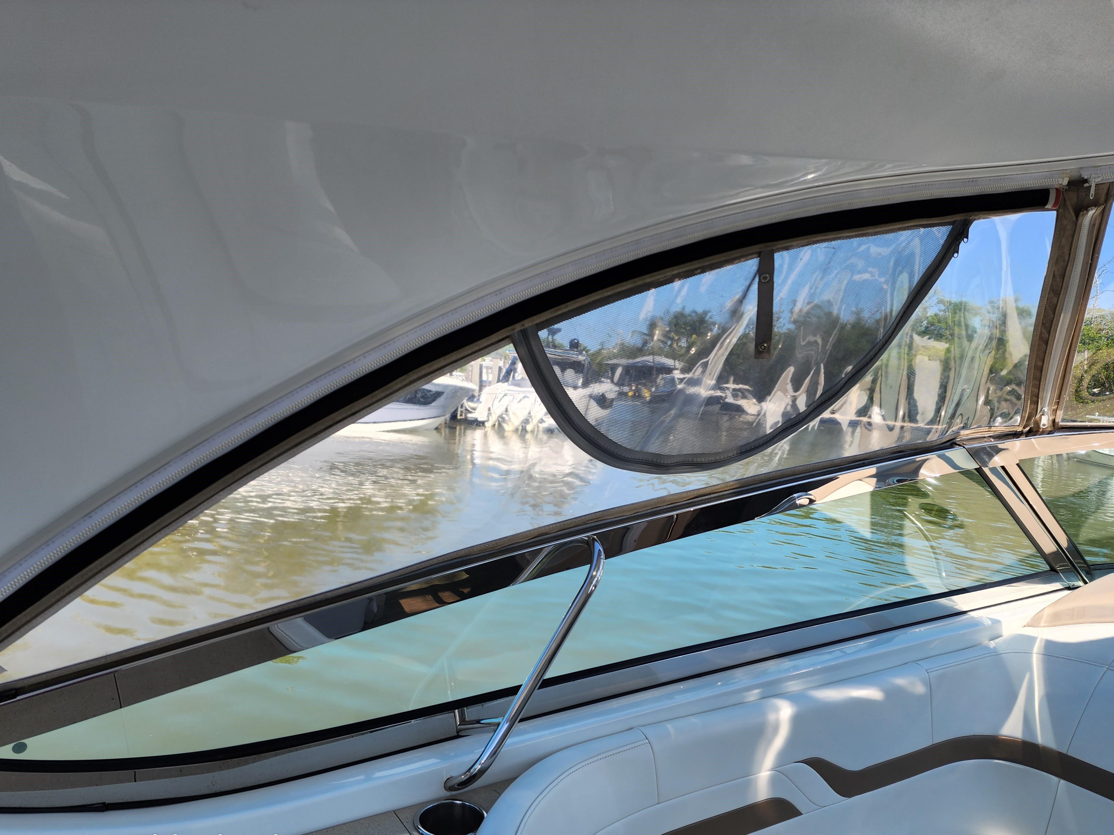 Interior view of 2012 Formula 400 Super Sport boat with water and dock in background.