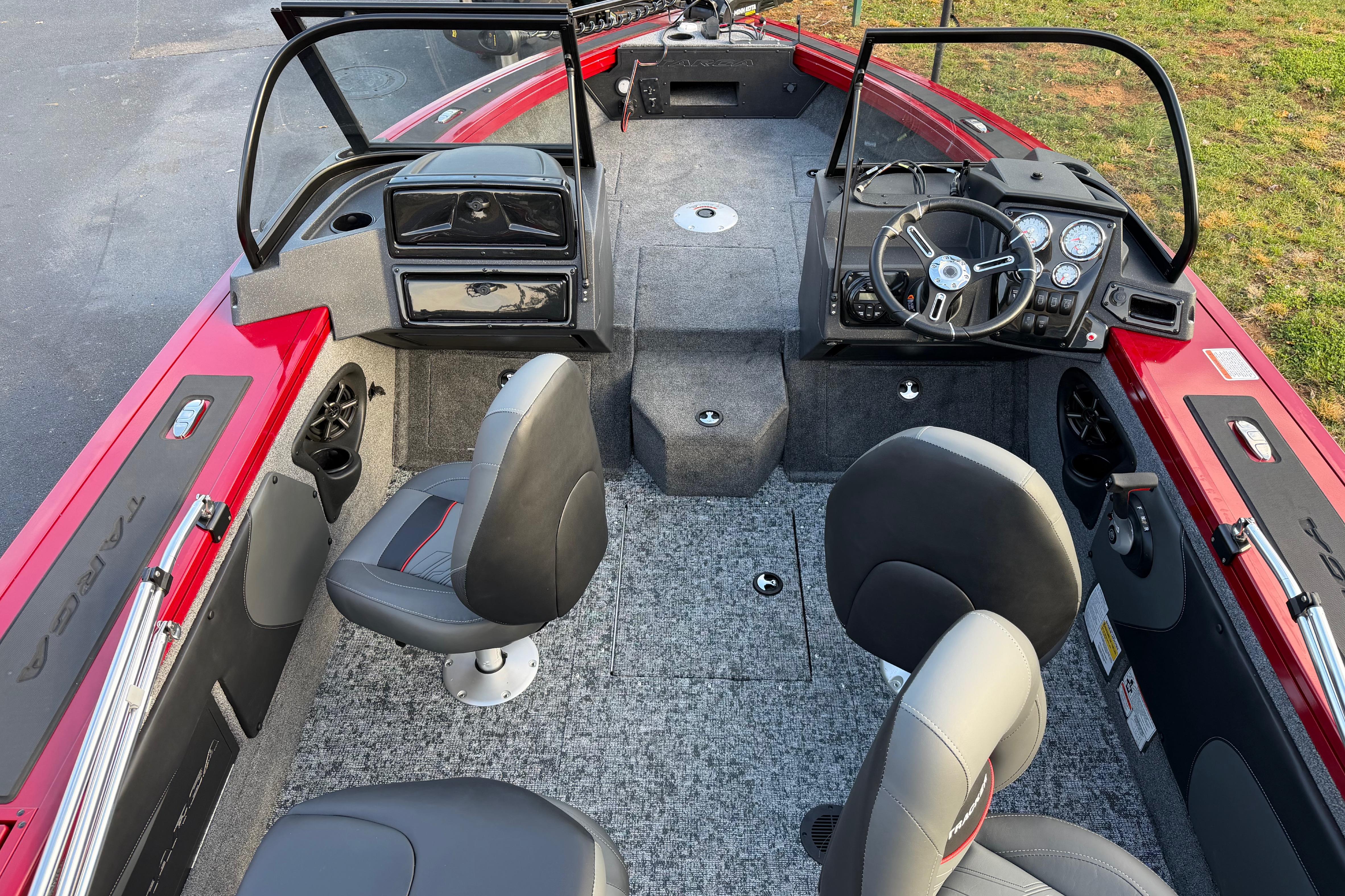 2026 Tracker Targa V-19 Combo boat interior with seating and dashboard, featuring red accents.