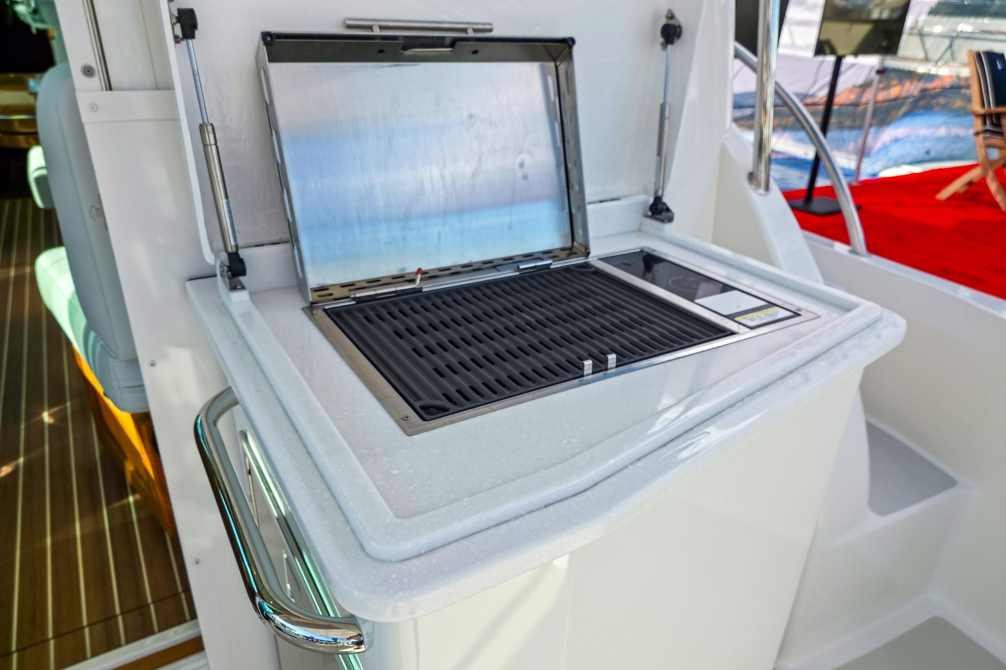 Outdoor grill on 2026 Back Cove 412 yacht, featuring sleek design and modern amenities.