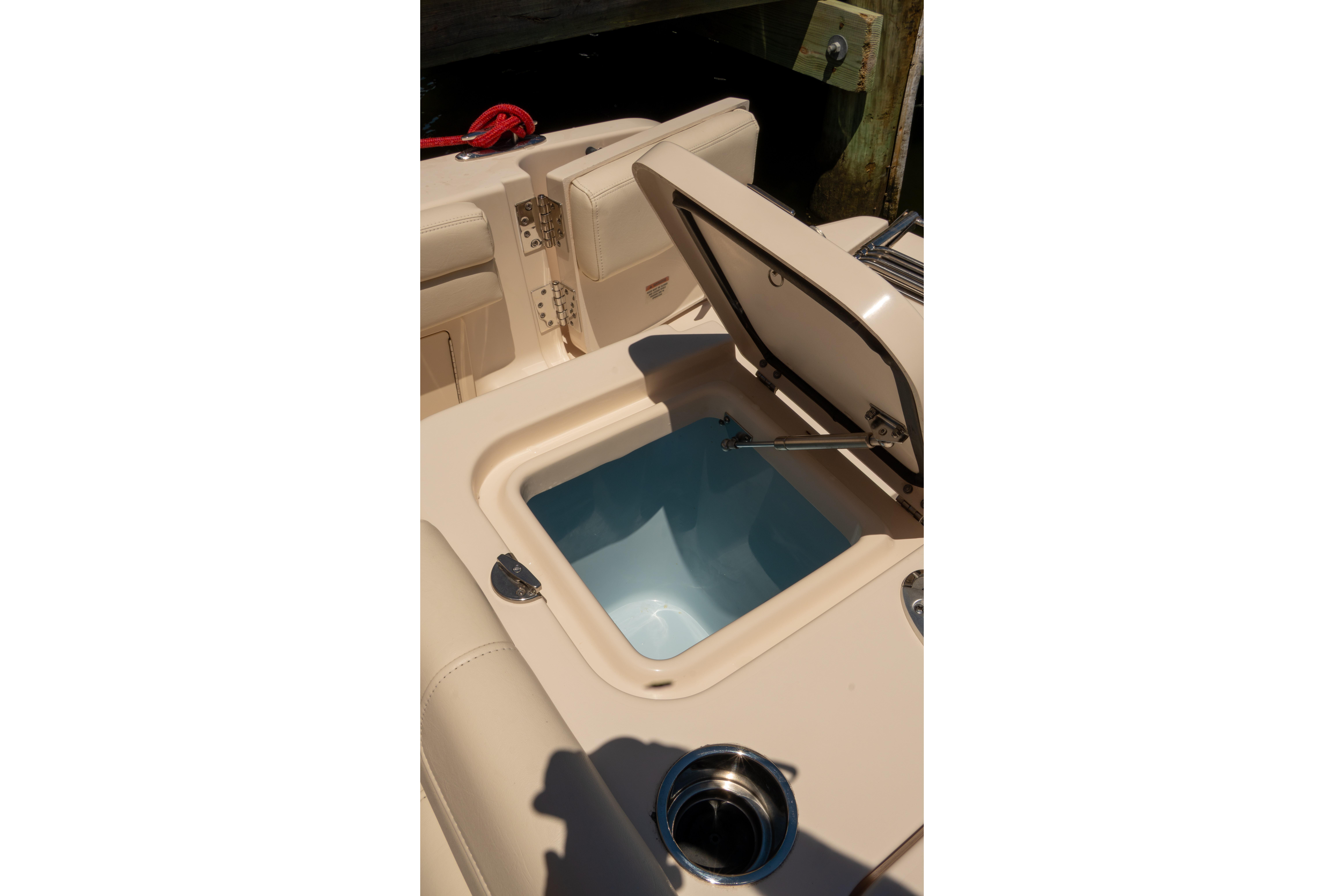Open storage compartment on 2022 Grady-White Freedom 235 boat.