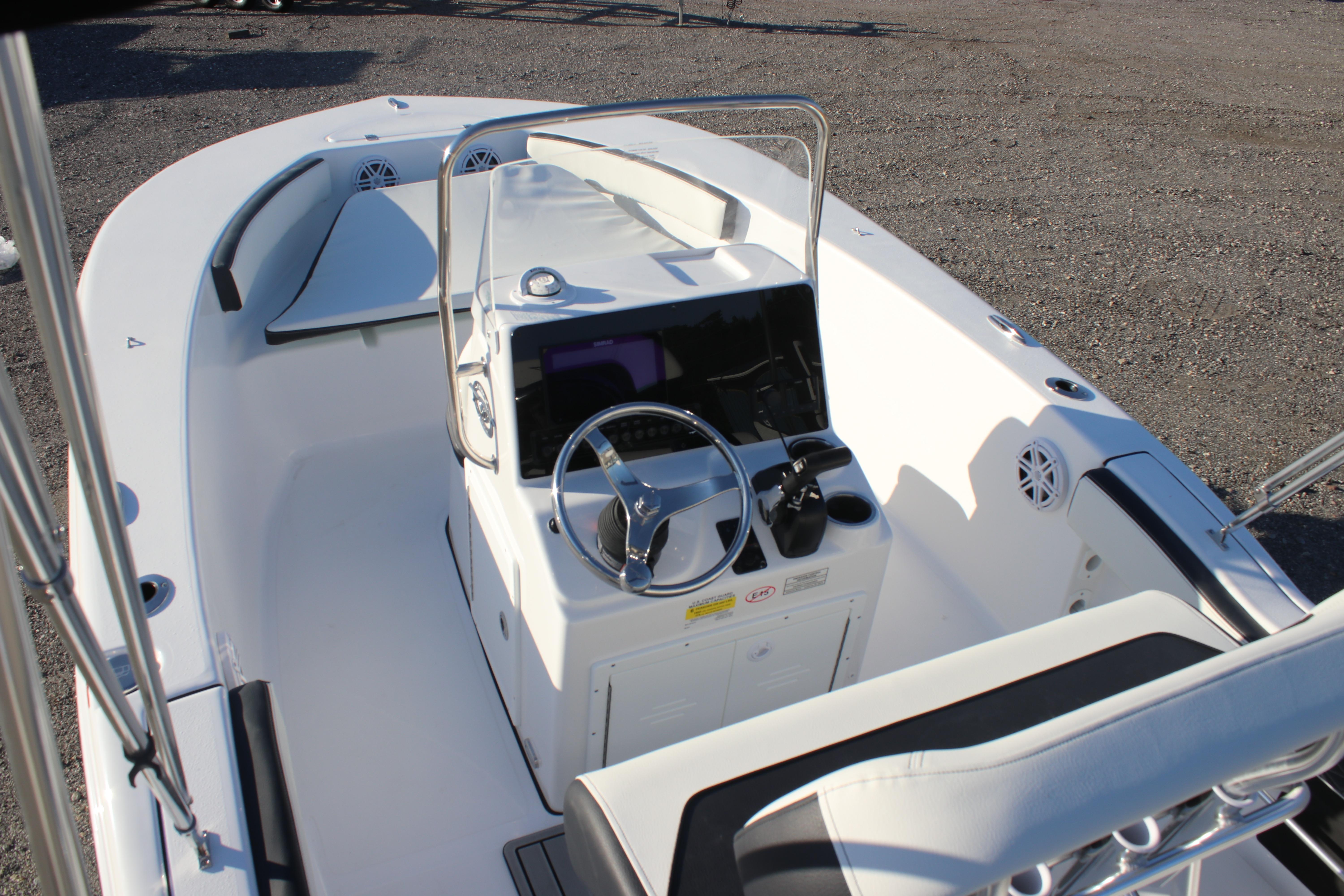 2026 Tidewater 180 CC Adventure boat interior with steering console and seating.