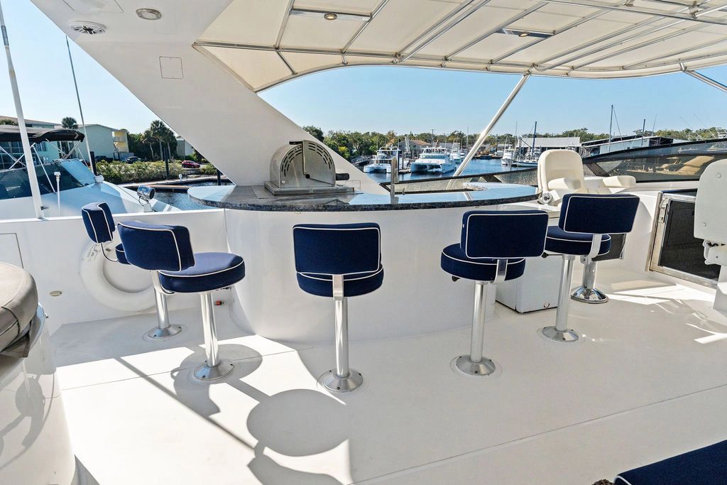 Luxurious Westport 112 yacht bar with blue stools, built in 1999.