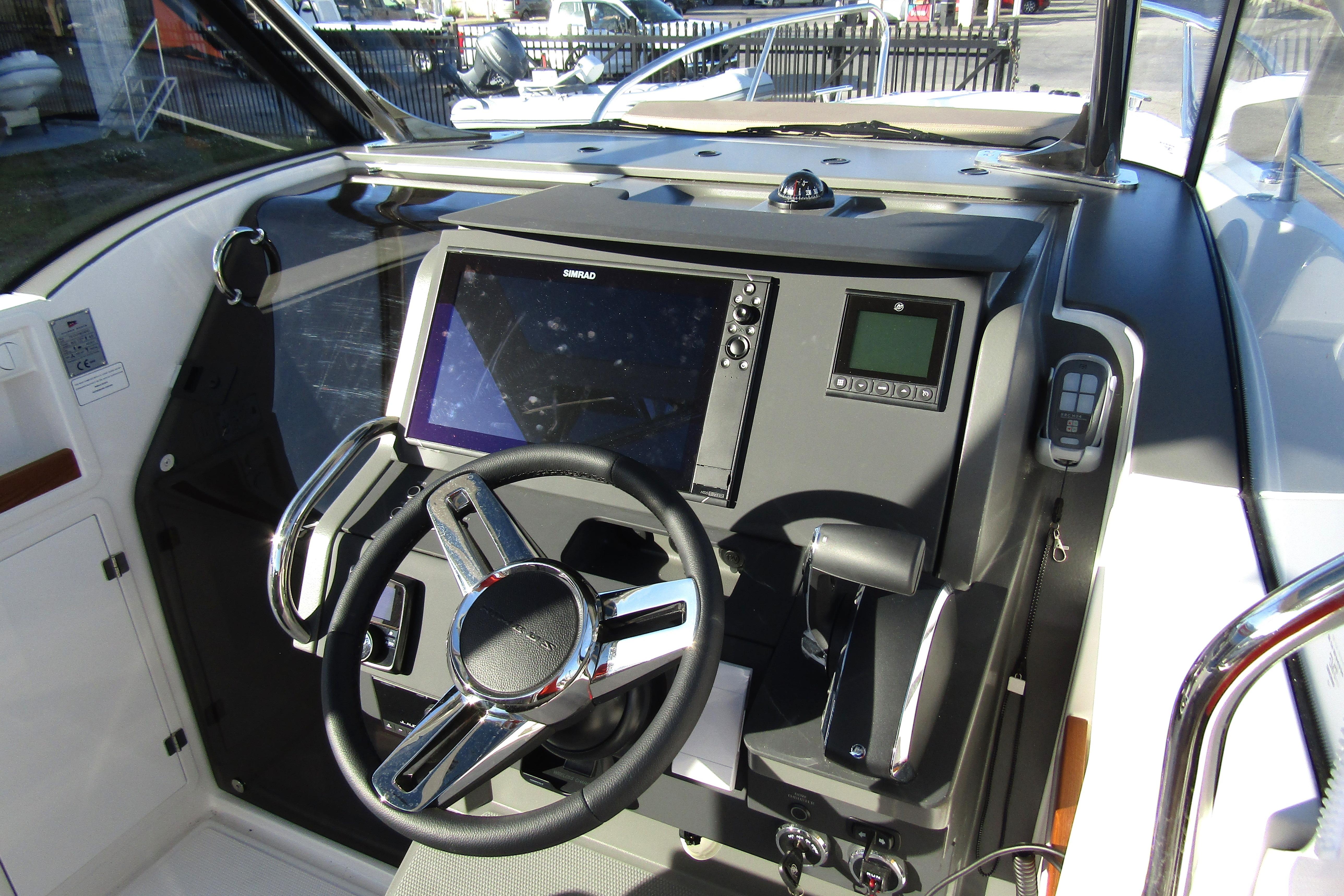 Helm of 2025 Nimbus Tender 9 with modern navigation system and steering wheel.