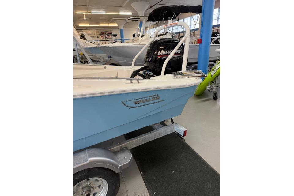 2026 Boston Whaler 160 Super Sport boat on display in showroom.