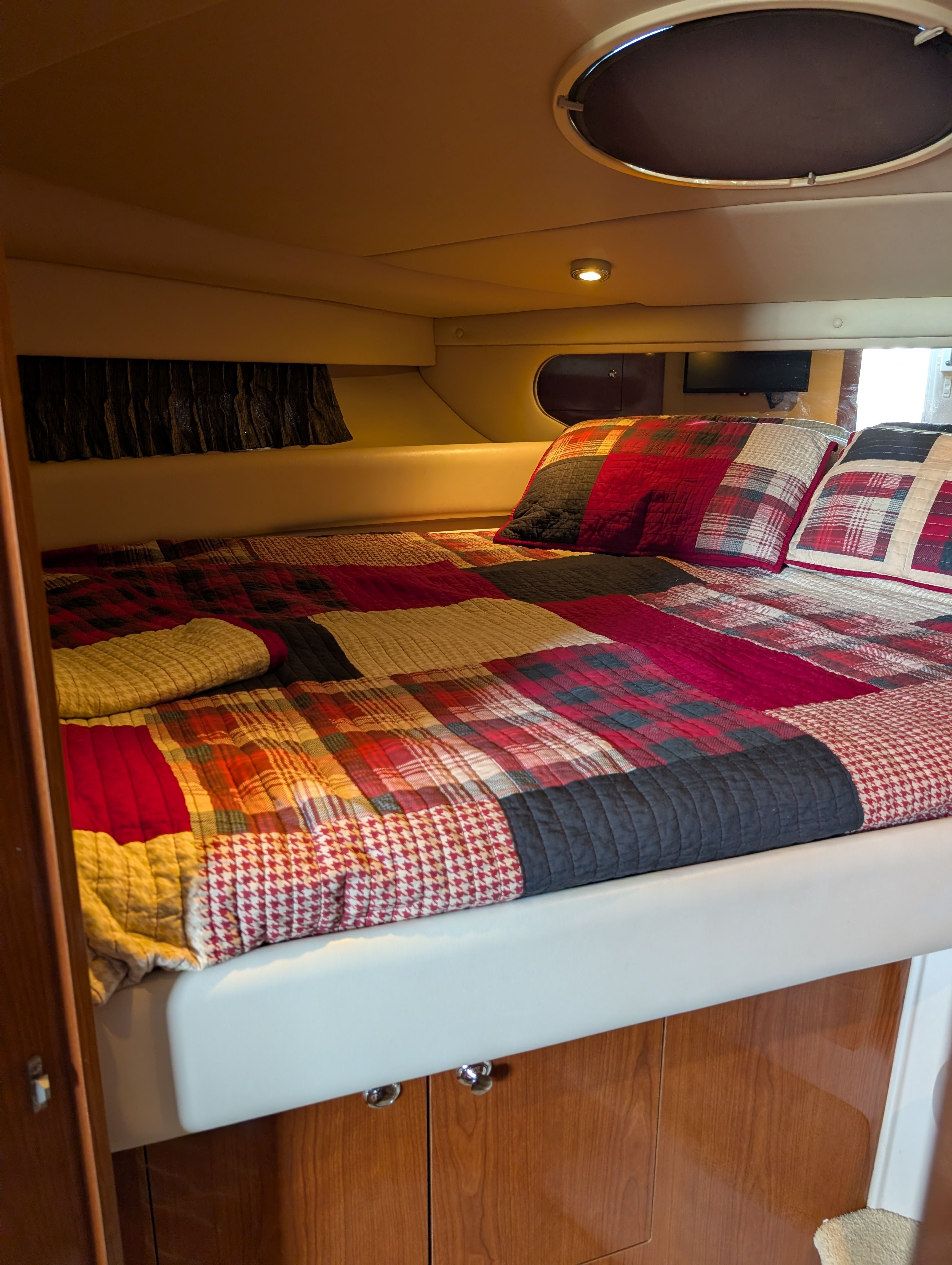 Interior of a Regal Commodore 3560 yacht with cozy bed.