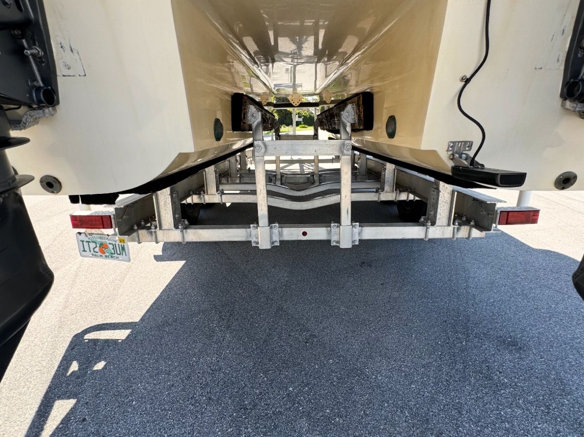 Rear view of a 2004 World Cat 270TE boat on a trailer.