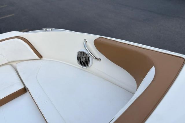 2017 Searay SPX210 boat interior with white and brown seating and speaker detail.