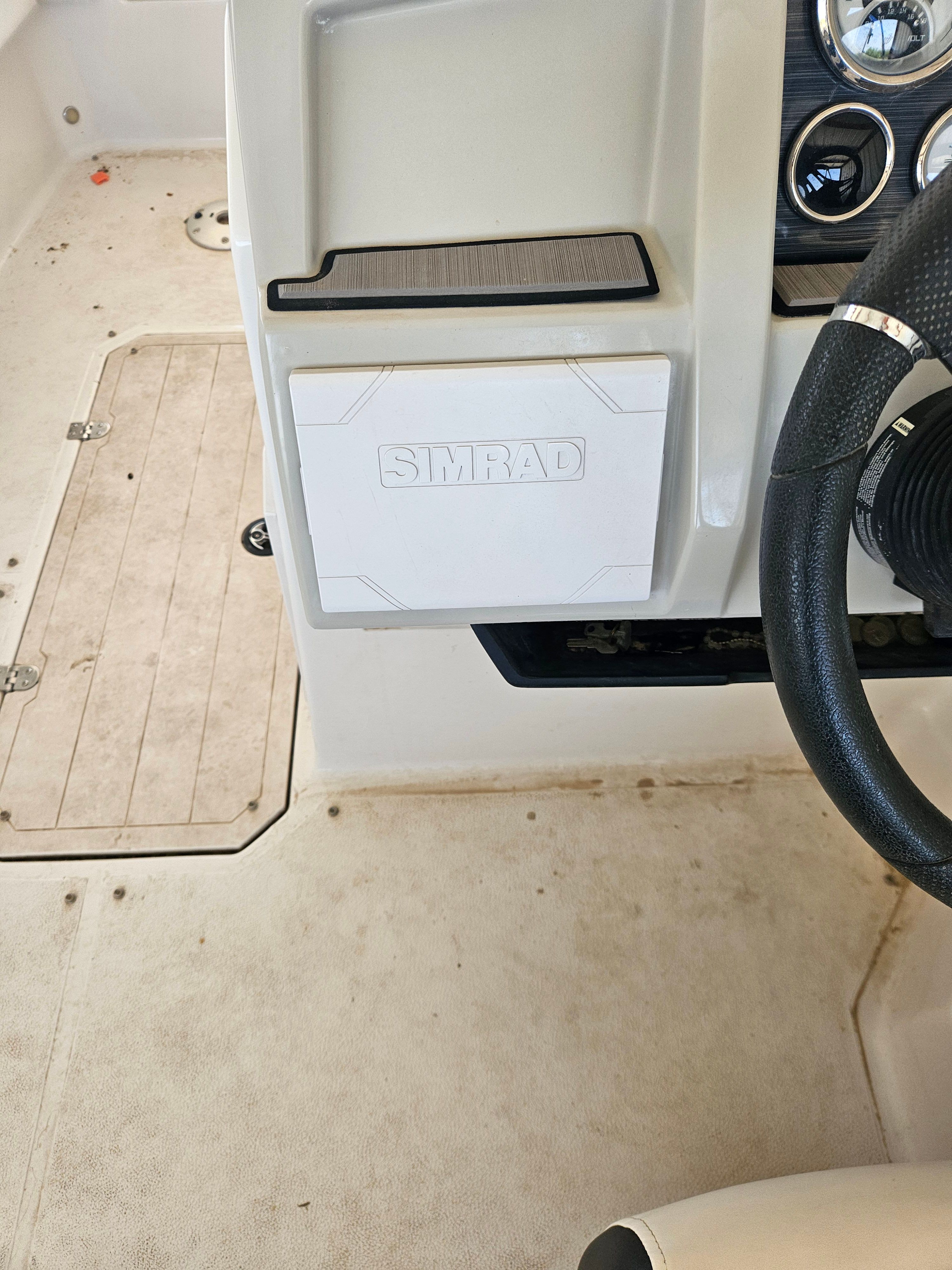 Interior view of a 2023 Starcraft SVX211 boat with Simrad controls.