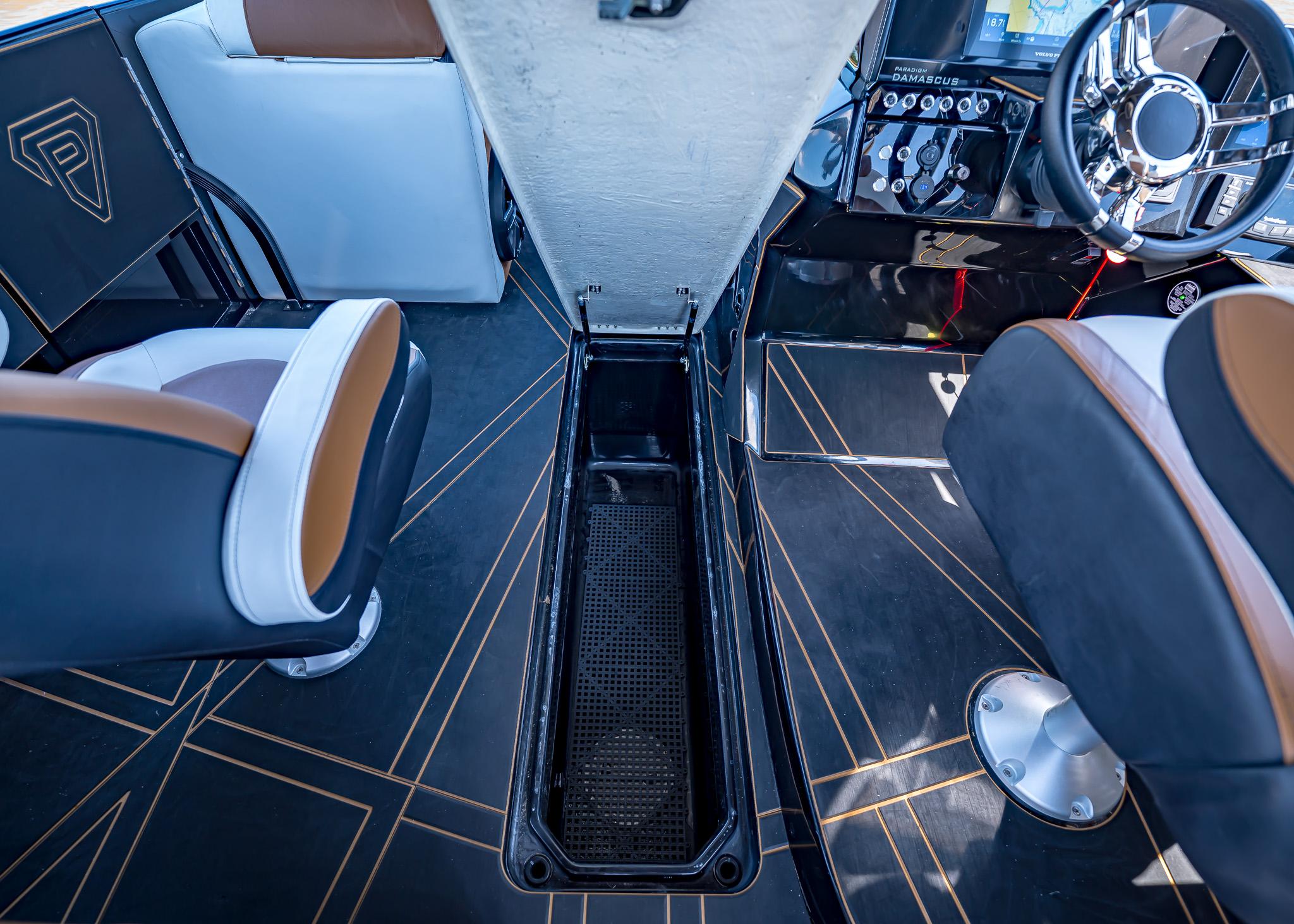 Interior of 2025 Paradigm 236 boat with modern seating and sleek dashboard design.