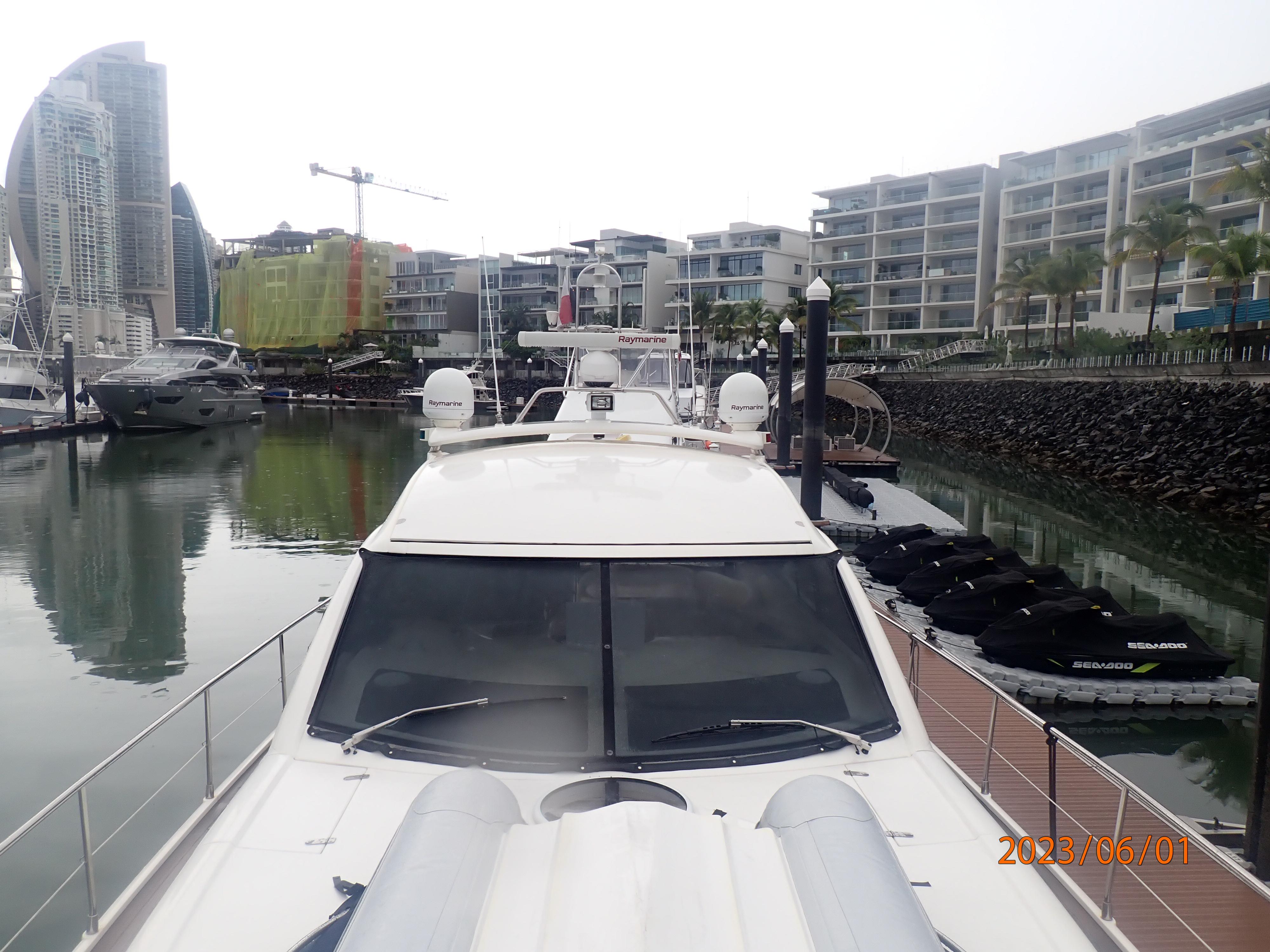 2007 Fairline Targa 52 GT yacht docked in a modern marina with surrounding buildings.