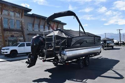 2026 Lowe SF 212 Sport Fish pontoon boat on trailer, parked outdoors.