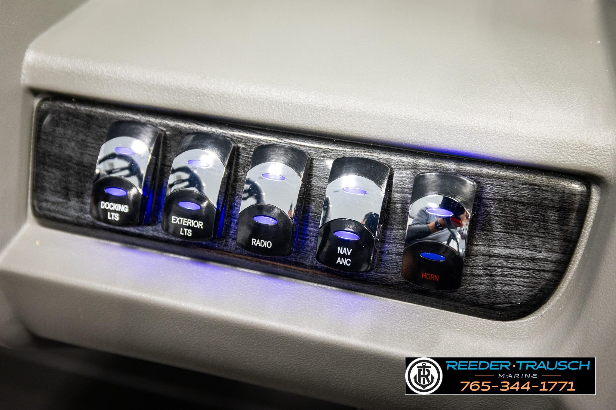 Control panel of 2026 Avalon LSZ QL with labeled switches for various functions.