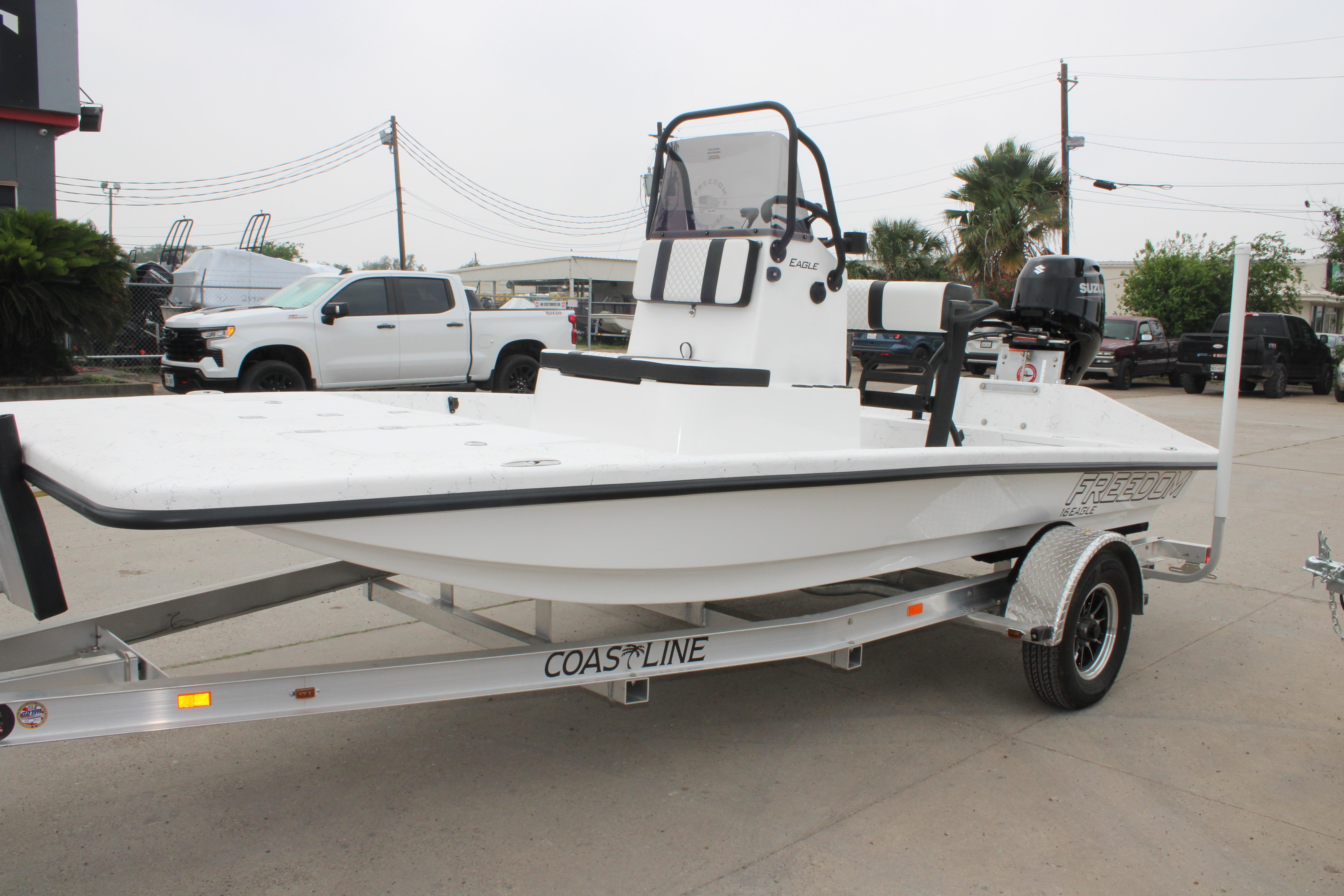 2026 Freedom Boats 16' Eagle on trailer, parked outdoors.