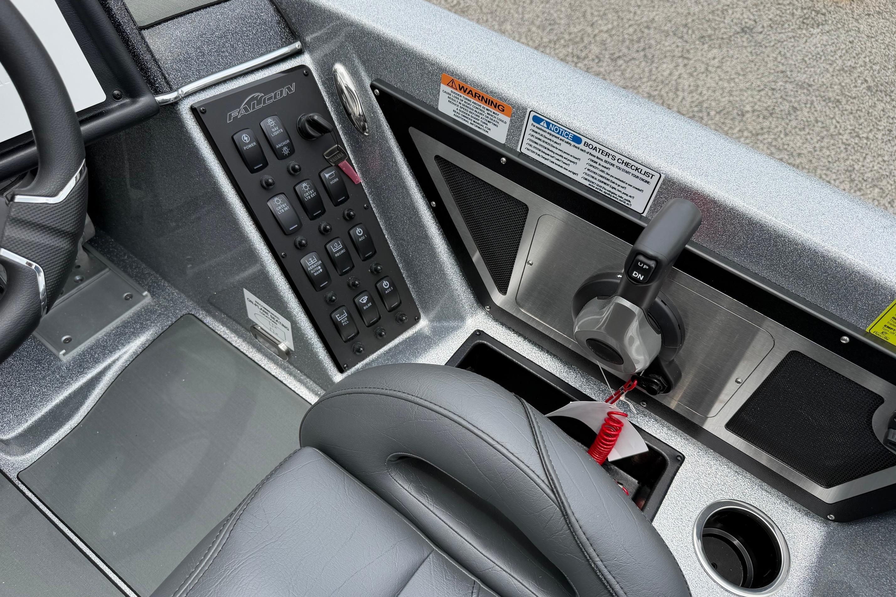 Control panel of 2027 Falcon F20 PREDATOR boat with steering and throttle controls.
