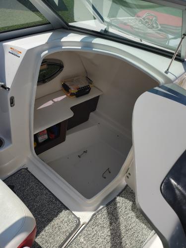 2014 Chaparral 224 Sunesta boat interior storage compartment.