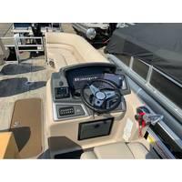 2025 Ranger Reata 223FC boat dashboard with steering wheel and controls.