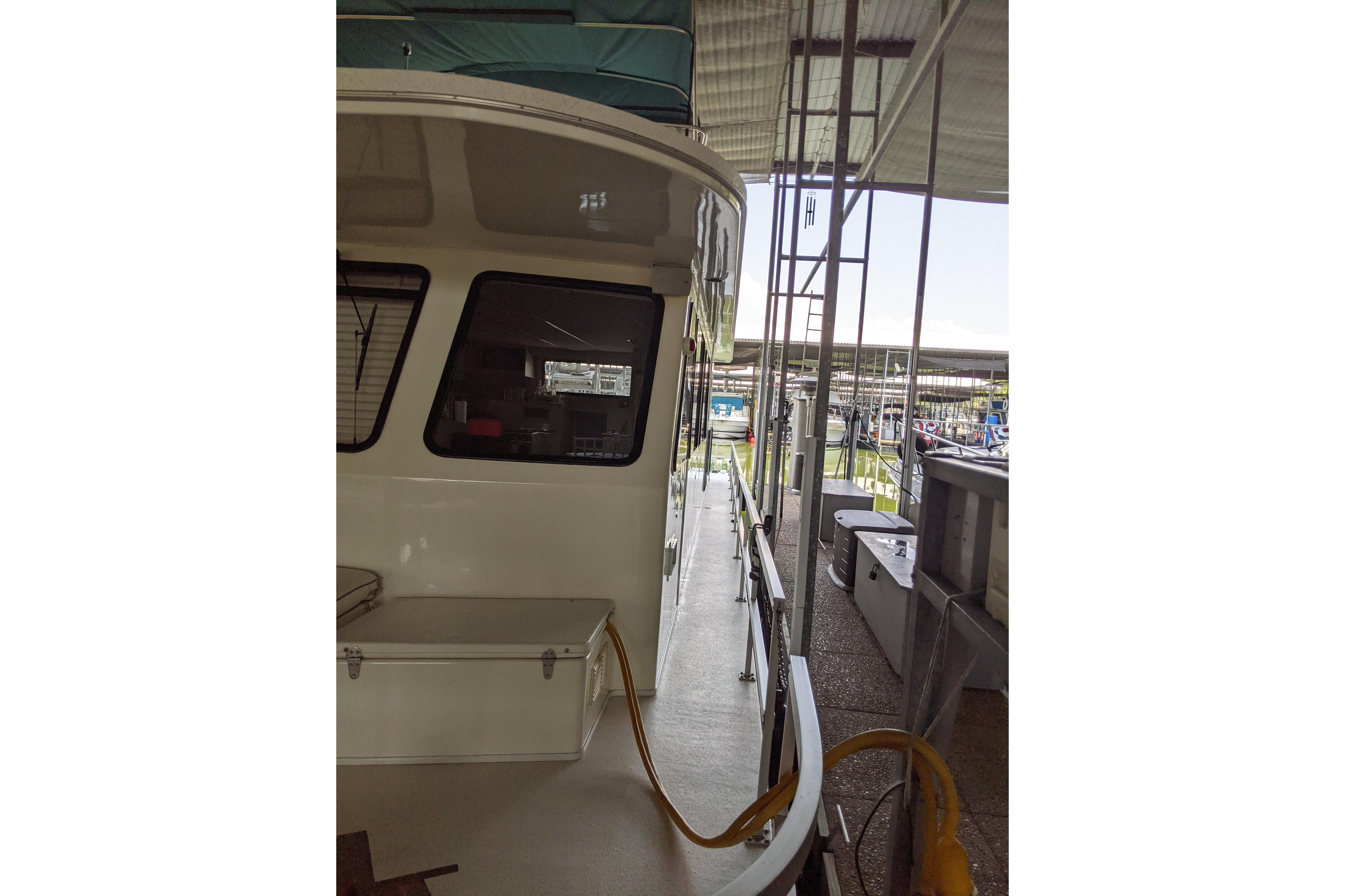 2001 Gibson 50 Cabin Yacht docked, showcasing side view and marina setting.