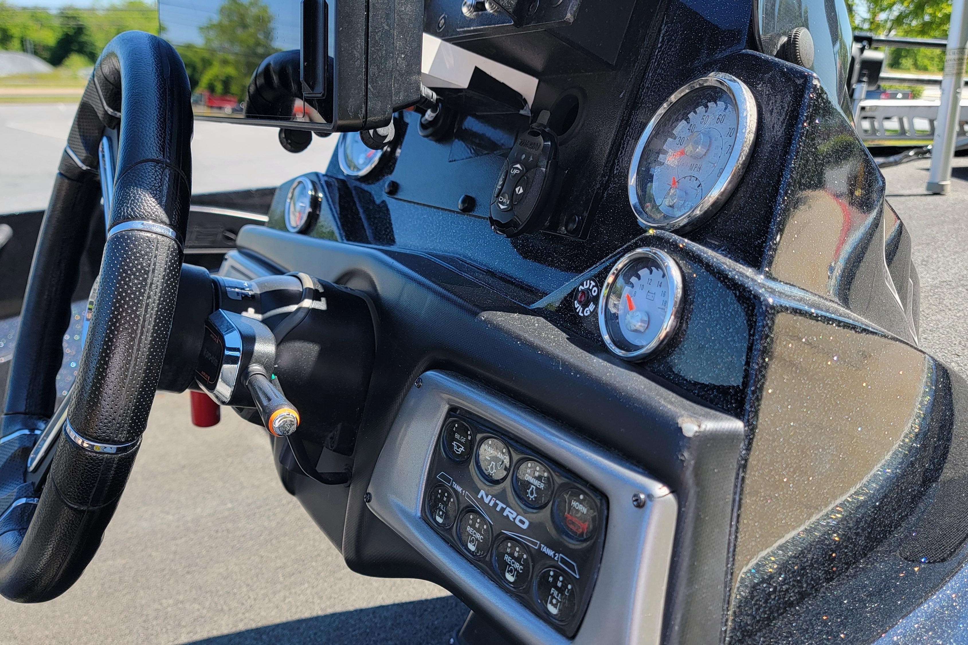 Dashboard of a 2020 Nitro Z19 Pro boat with steering wheel and gauges.