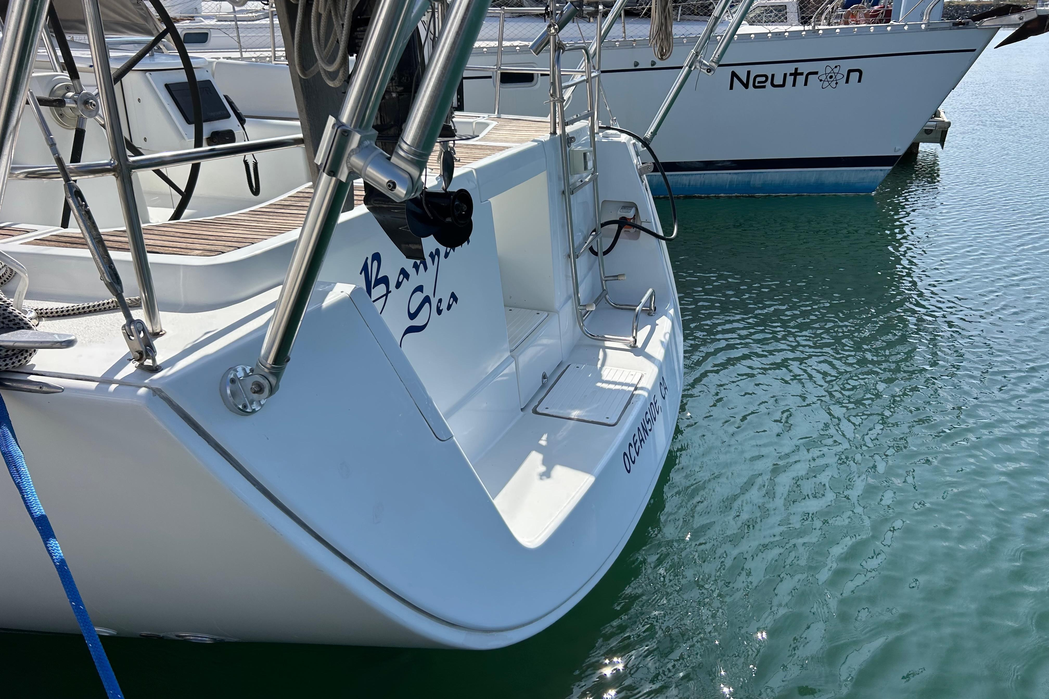 2008 Beneteau Oceanis 43 sailboat docked in marina, featuring sleek design and ladder.