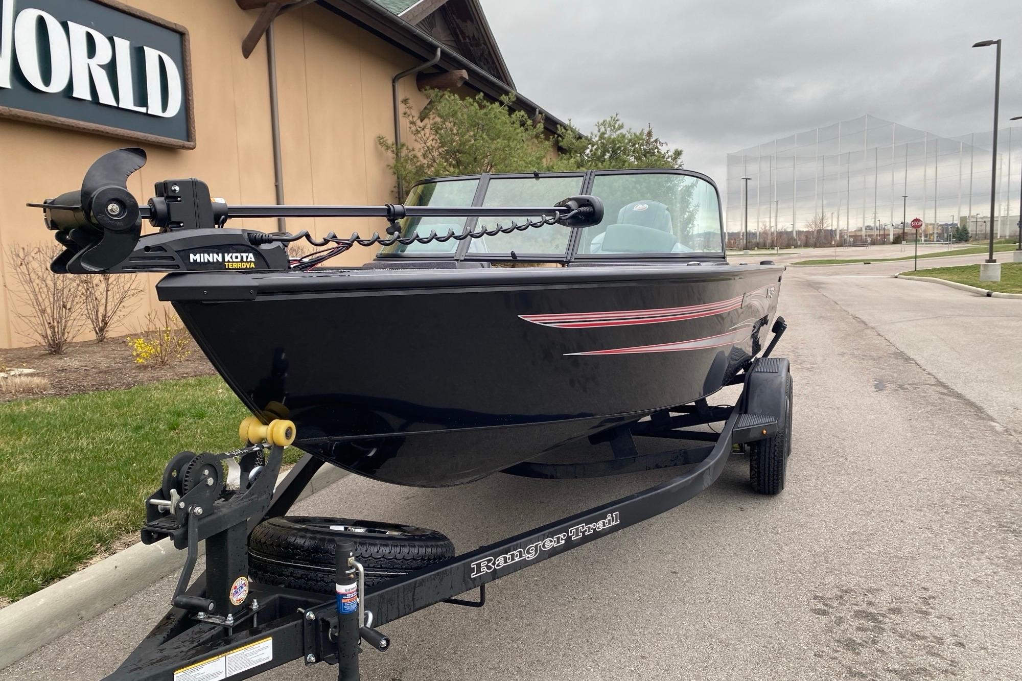 2026 Ranger VS1882SC Angler boat on trailer, parked outdoors near a building.