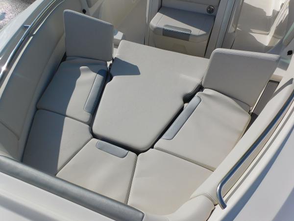 2025 Sailfish 232 CC boat interior with cushioned seating area.