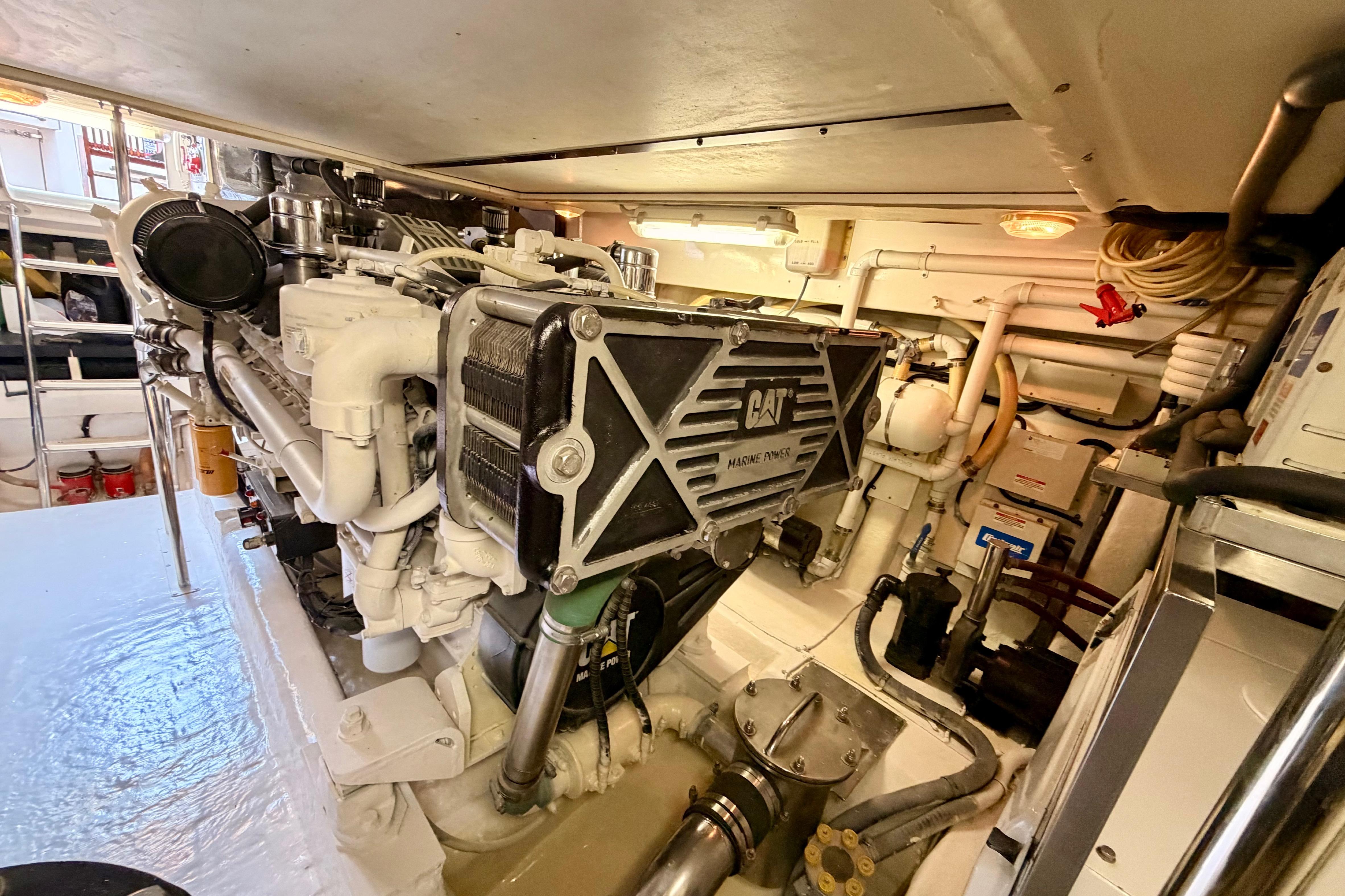 Engine room of a 2004 Riviera 60 Flybridge yacht with CAT marine engine.
