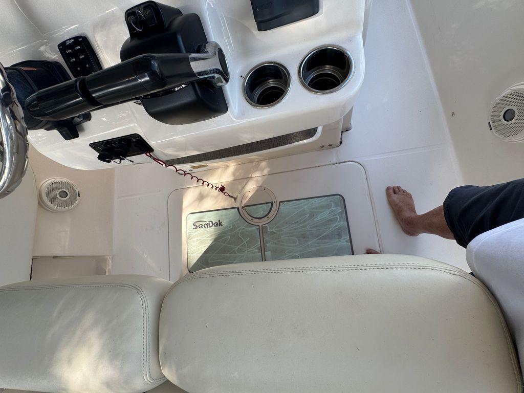 2017 Grady-White Fisherman 257 boat interior with steering, cup holders, and SeaDek flooring.