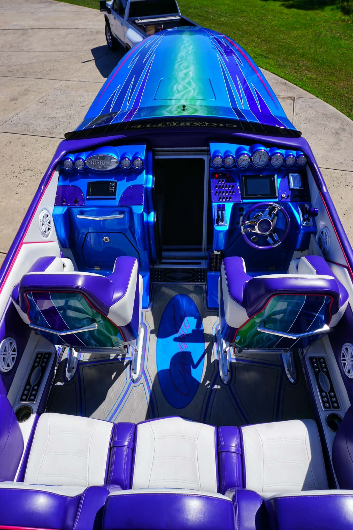 Interior of a 2018 Cigarette TopGun Unlimited boat, blue and purple design.