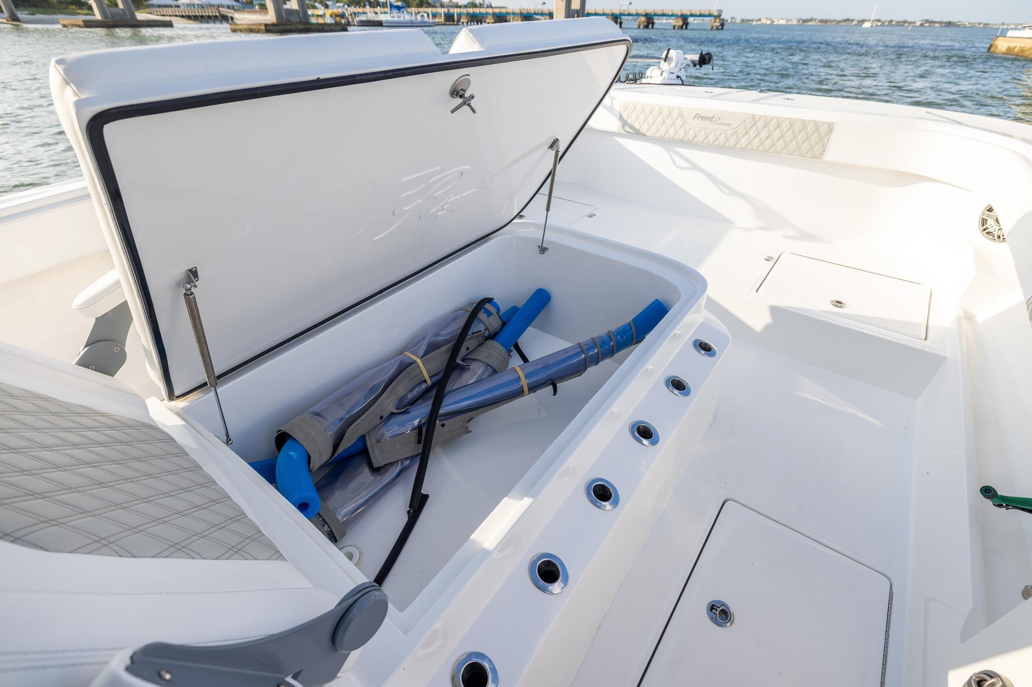Open storage compartment on 2026 Front Runner 37 Catamaran, showcasing spacious interior and equipment.
