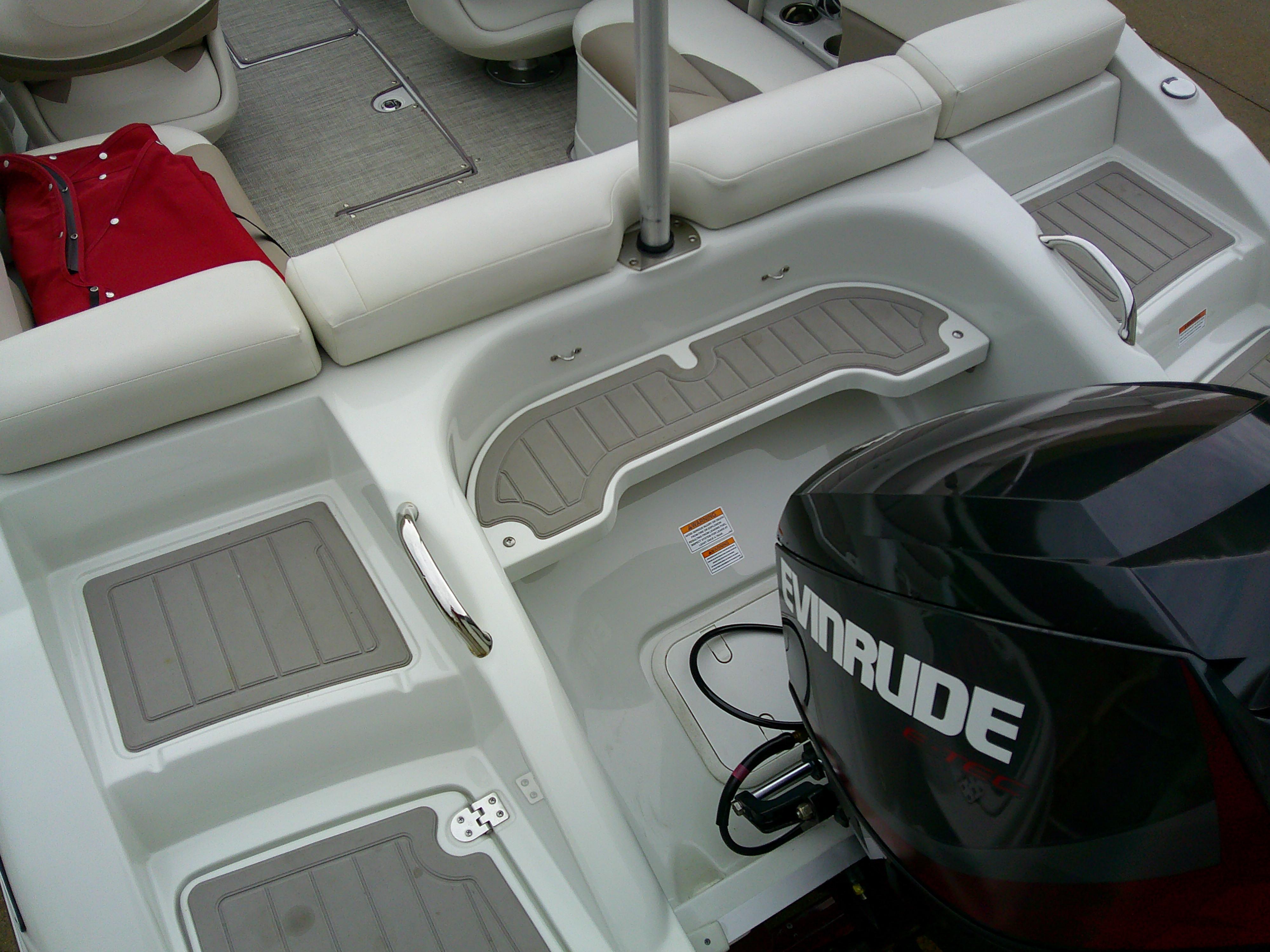 2019 Crownline 19 XS boat interior with Evinrude engine and seating area.