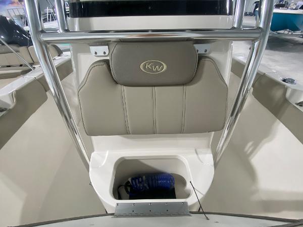 2024 Key West 203 FS boat interior with storage compartment and KW logo.