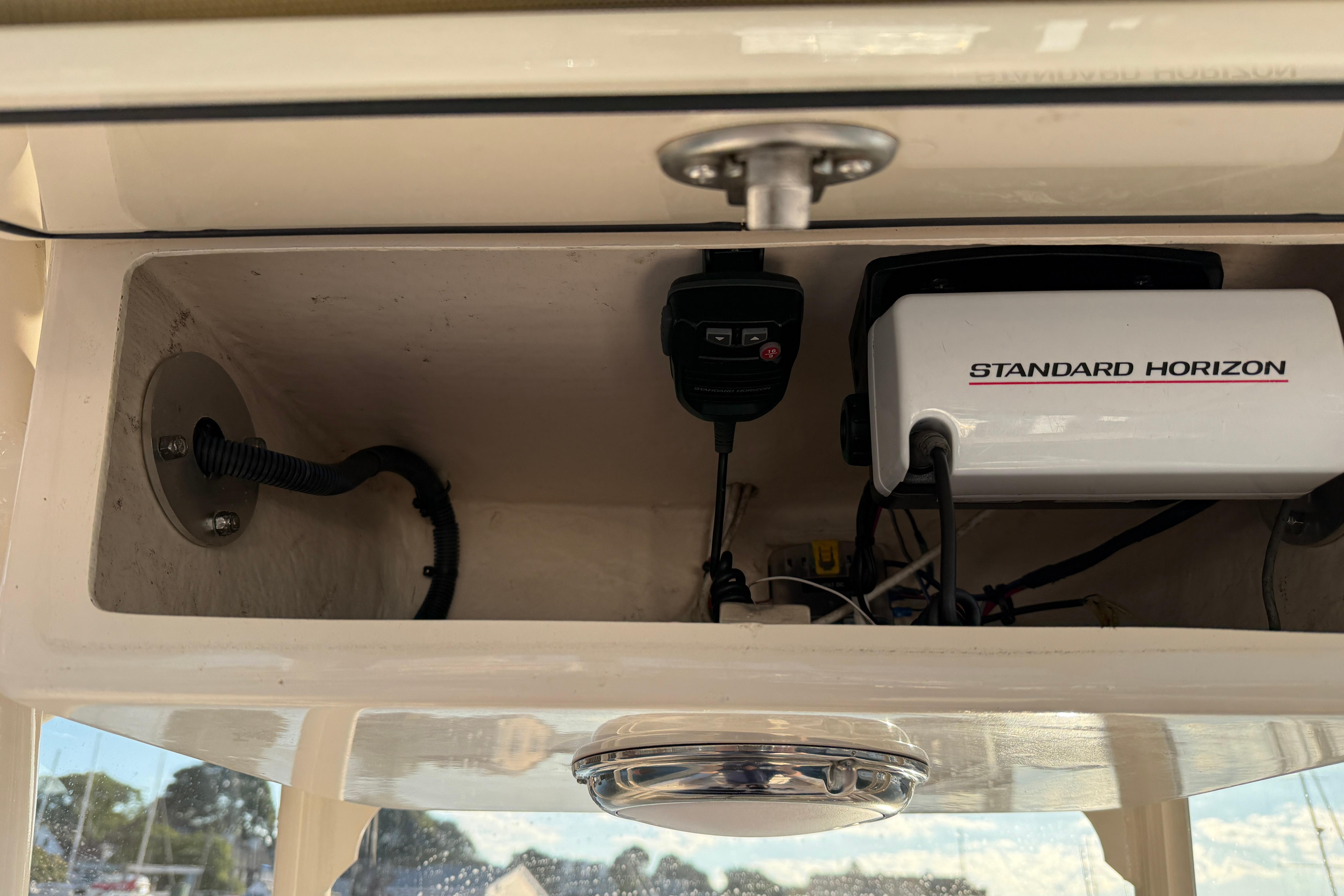 2017 Grady White 257 Fisherman boat electronics compartment with Standard Horizon equipment.