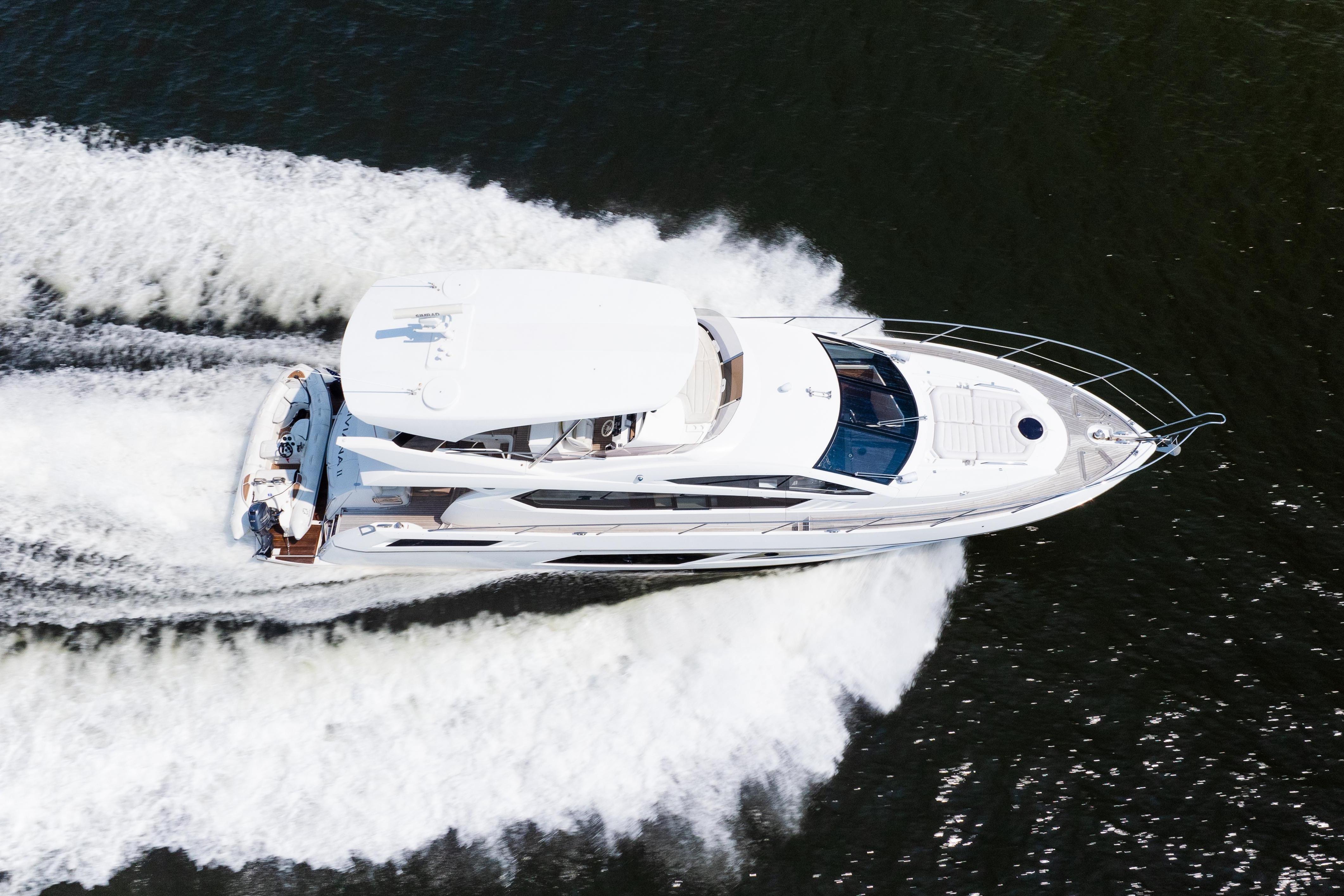 Aerial view of 2016 Sunseeker Manhattan 65 yacht cruising on water.