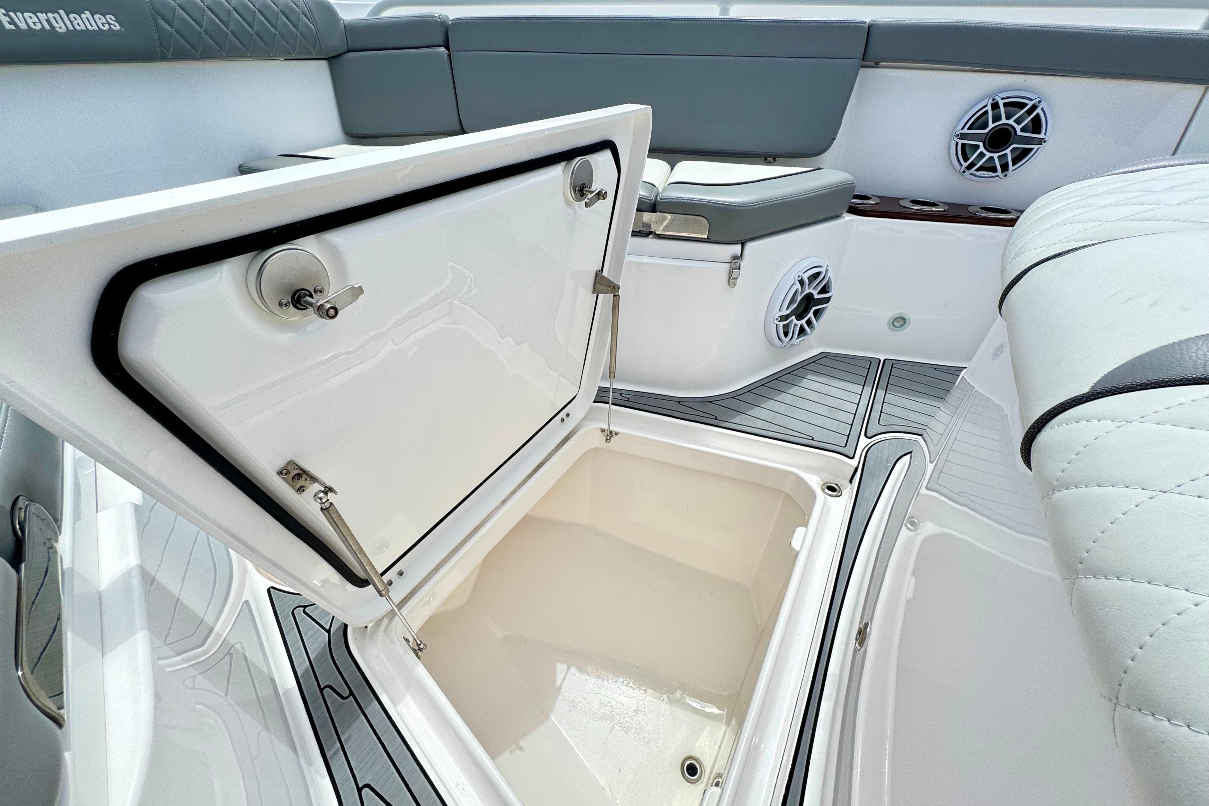 2023 Everglades 395 Center Console boat interior with open storage compartment.